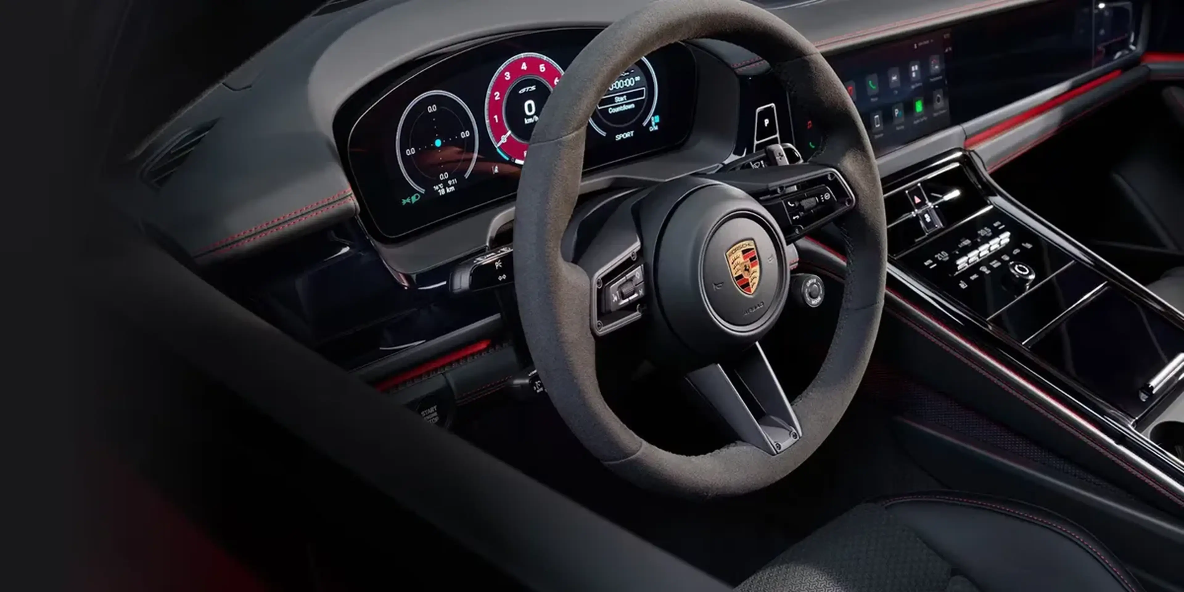 Digital cockpit of the 2026 Porsche Panamera GTS with dual displays and red stitching