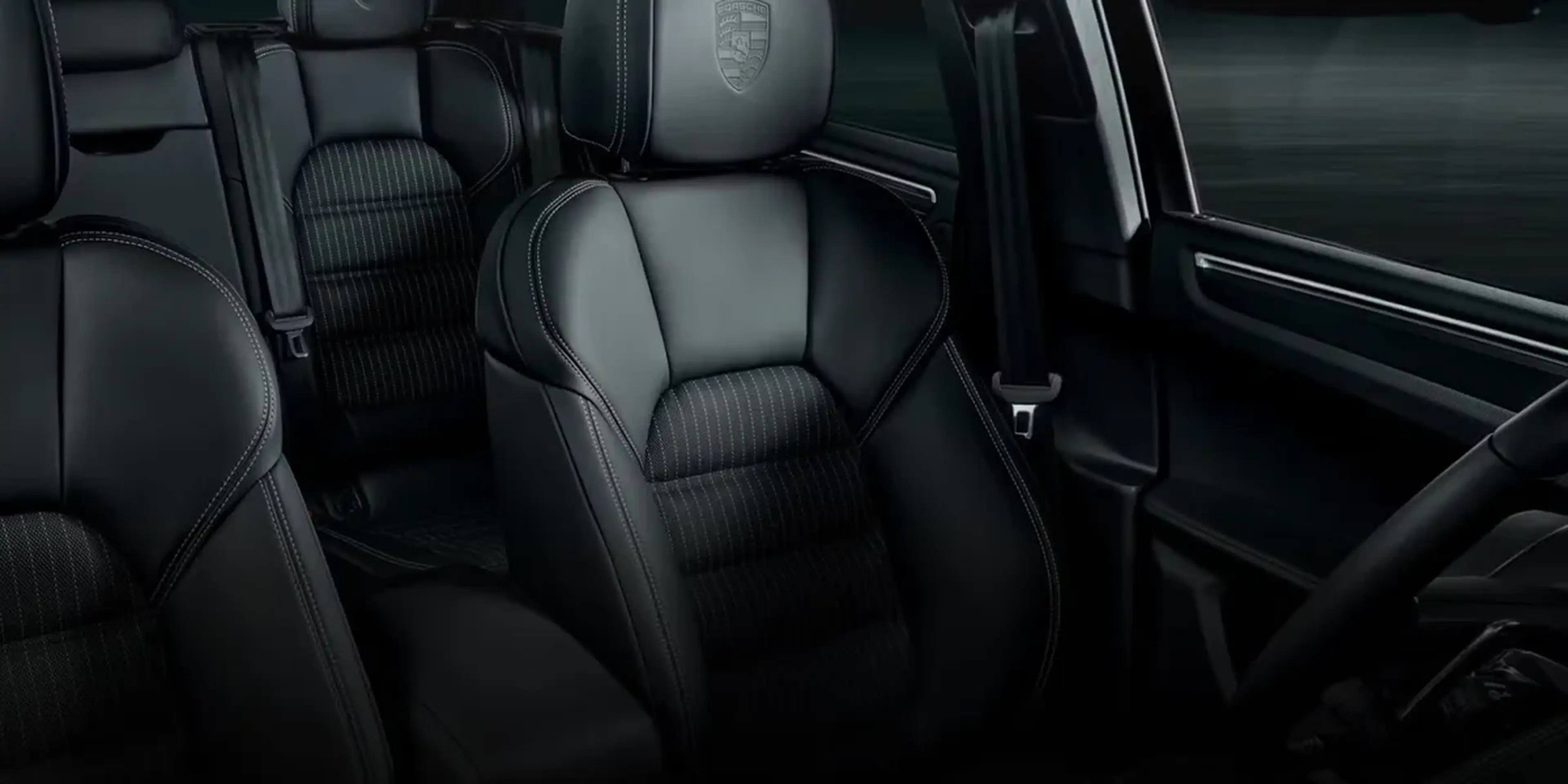 Interior view of Porsche Macan T front and rear leather sport seats with contrast stitching