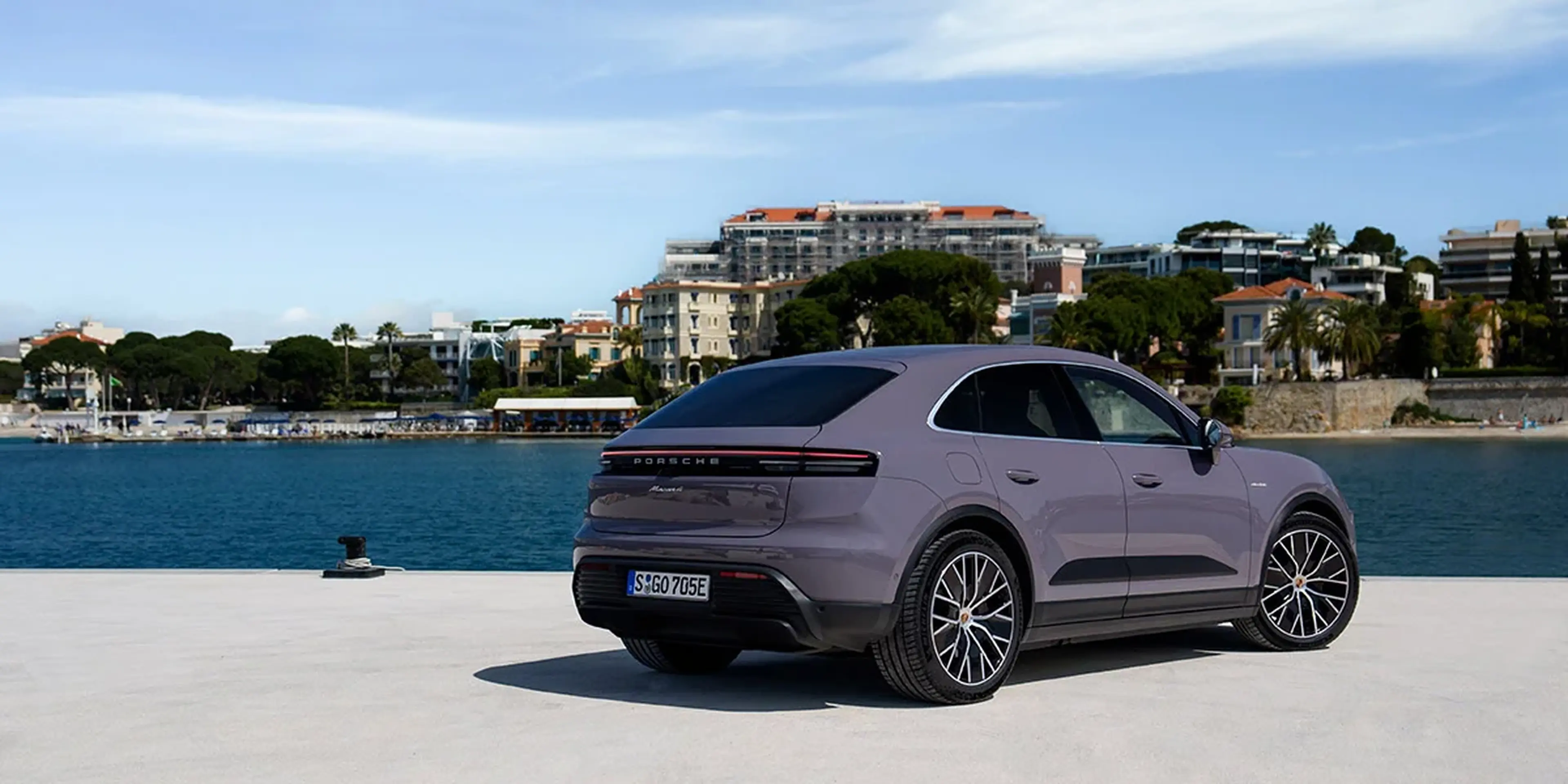 2025 Porsche Macan 4 Electric rear view by the waterfront