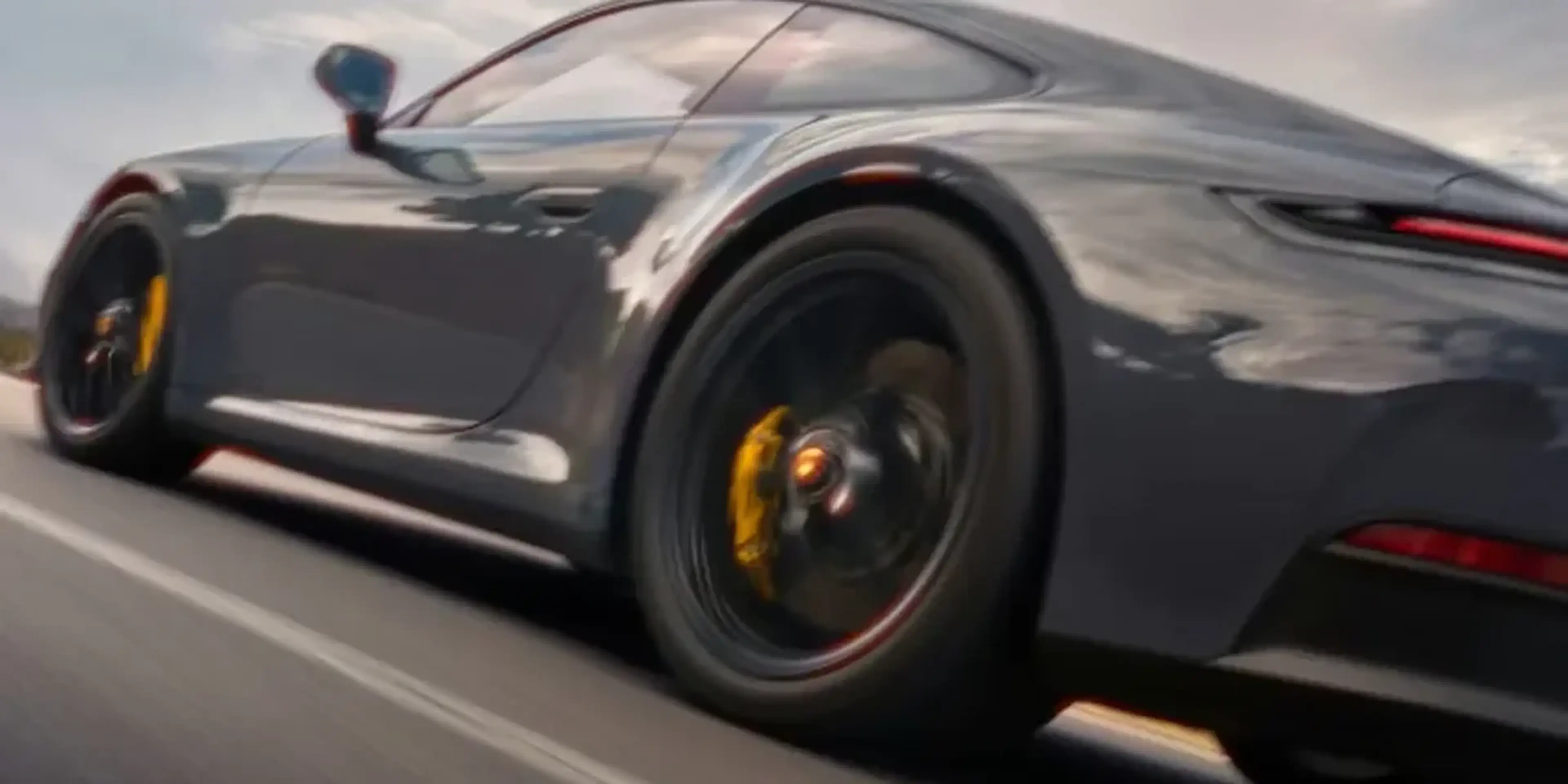 Porsche 911 twin-turbocharged flat-six engine detail emphasizing performance engineering.
