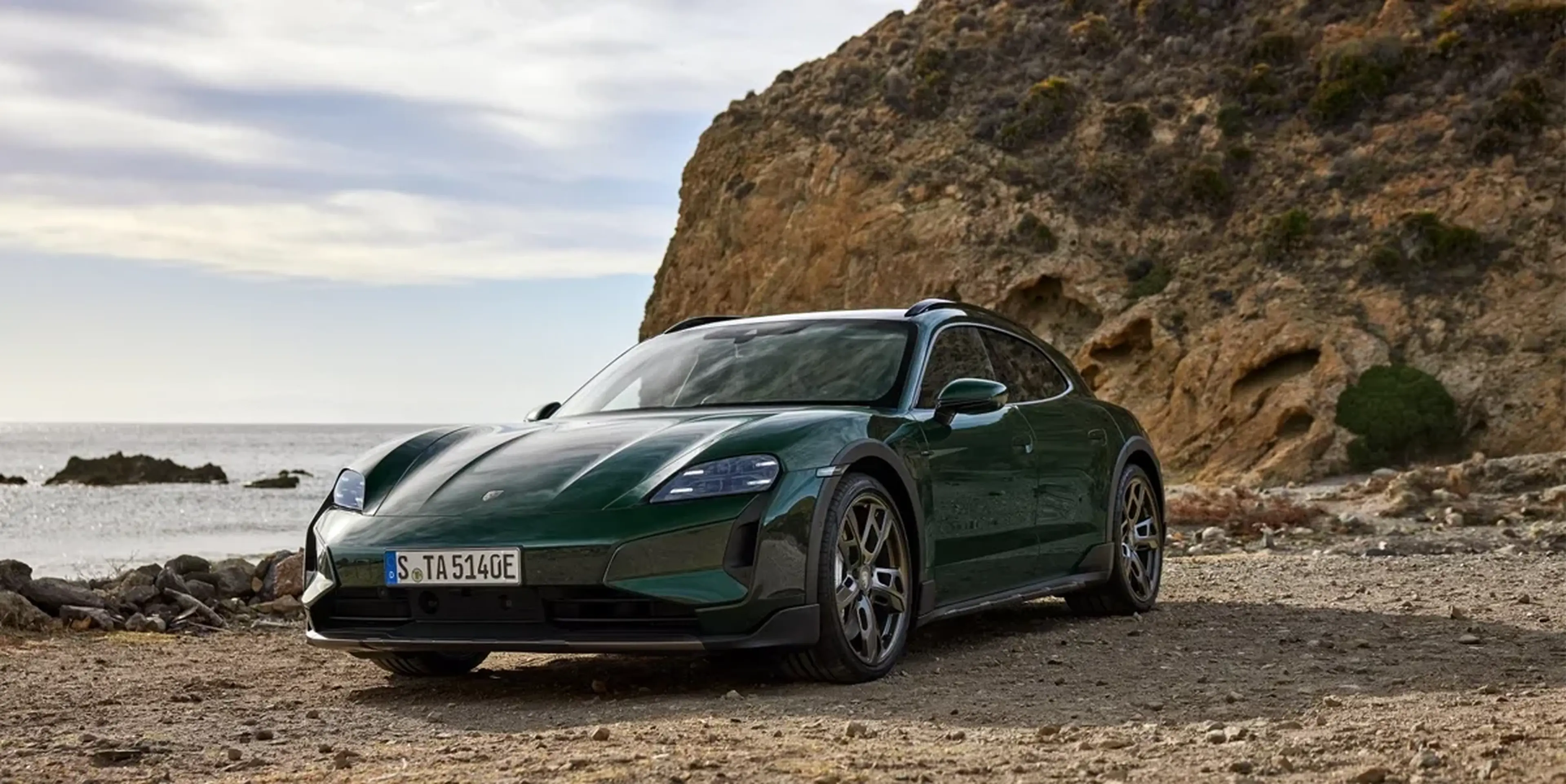 Green 2025 Porsche Taycan on a mountain road