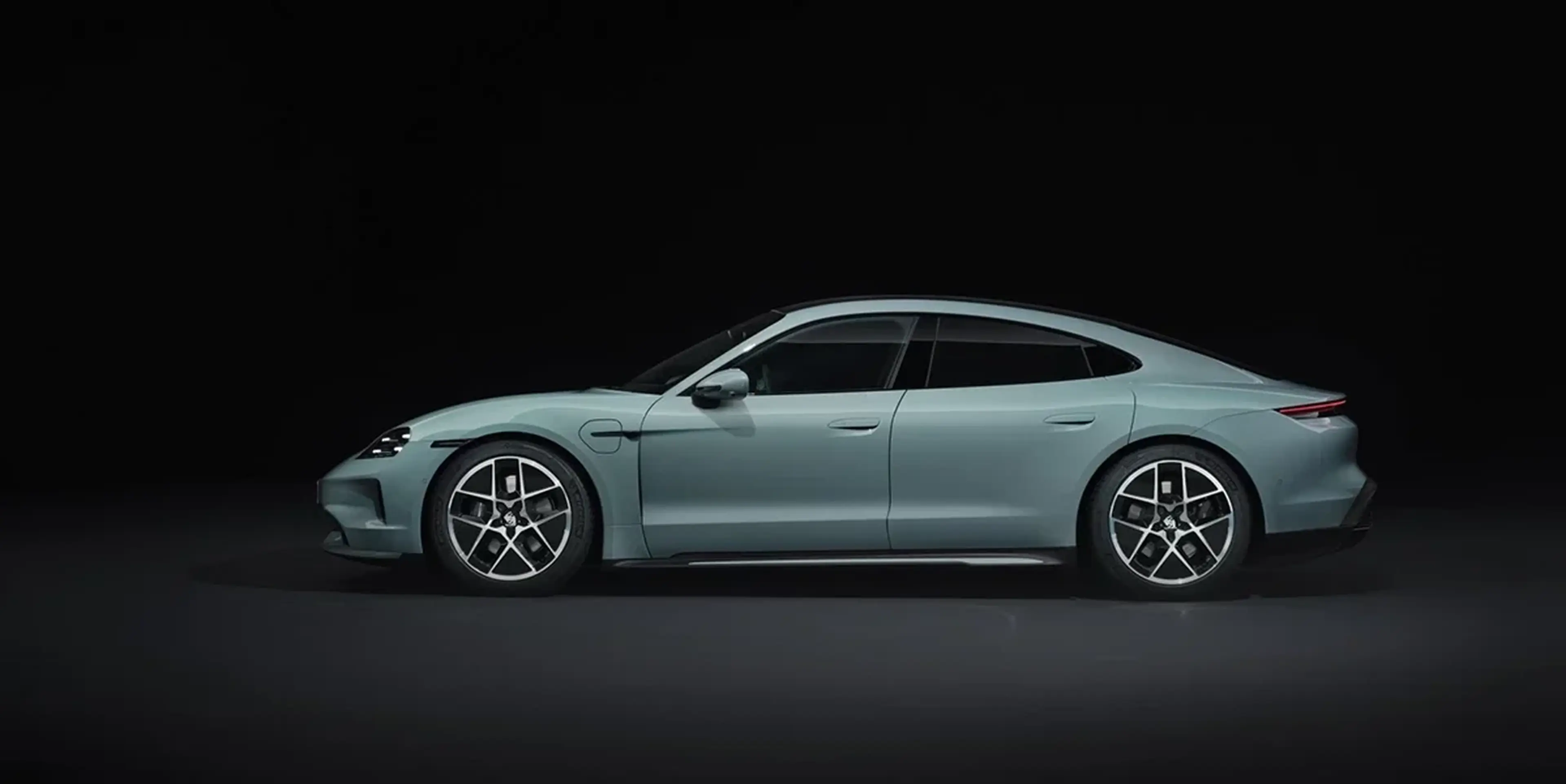 Mint green 2025 Porsche Taycan side profile