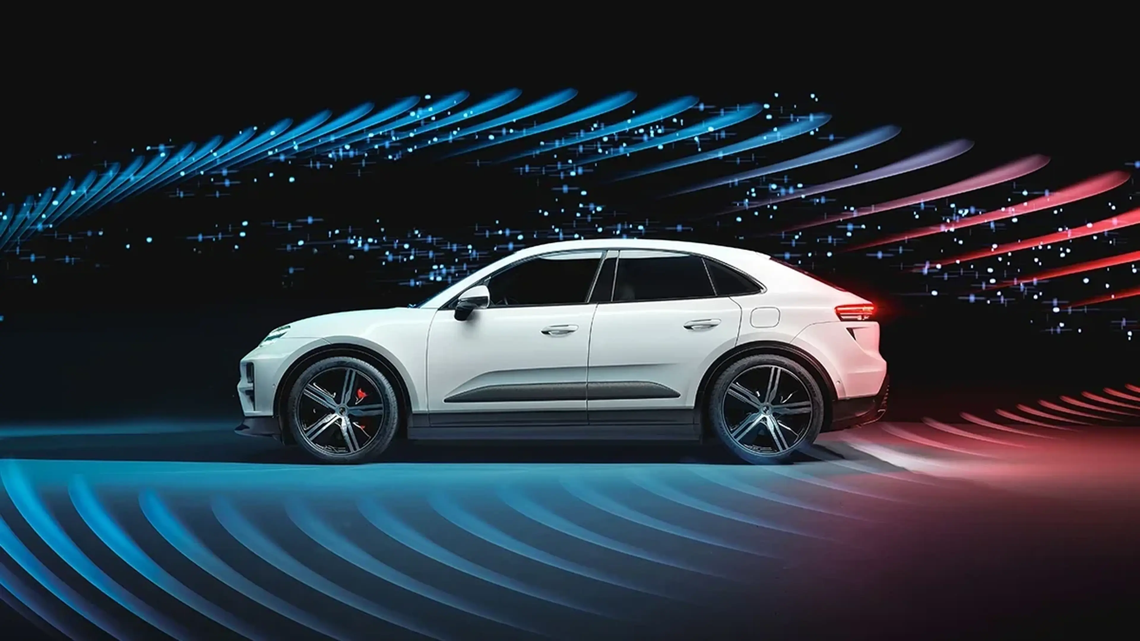 White Porsche Macan Electric with light streaks