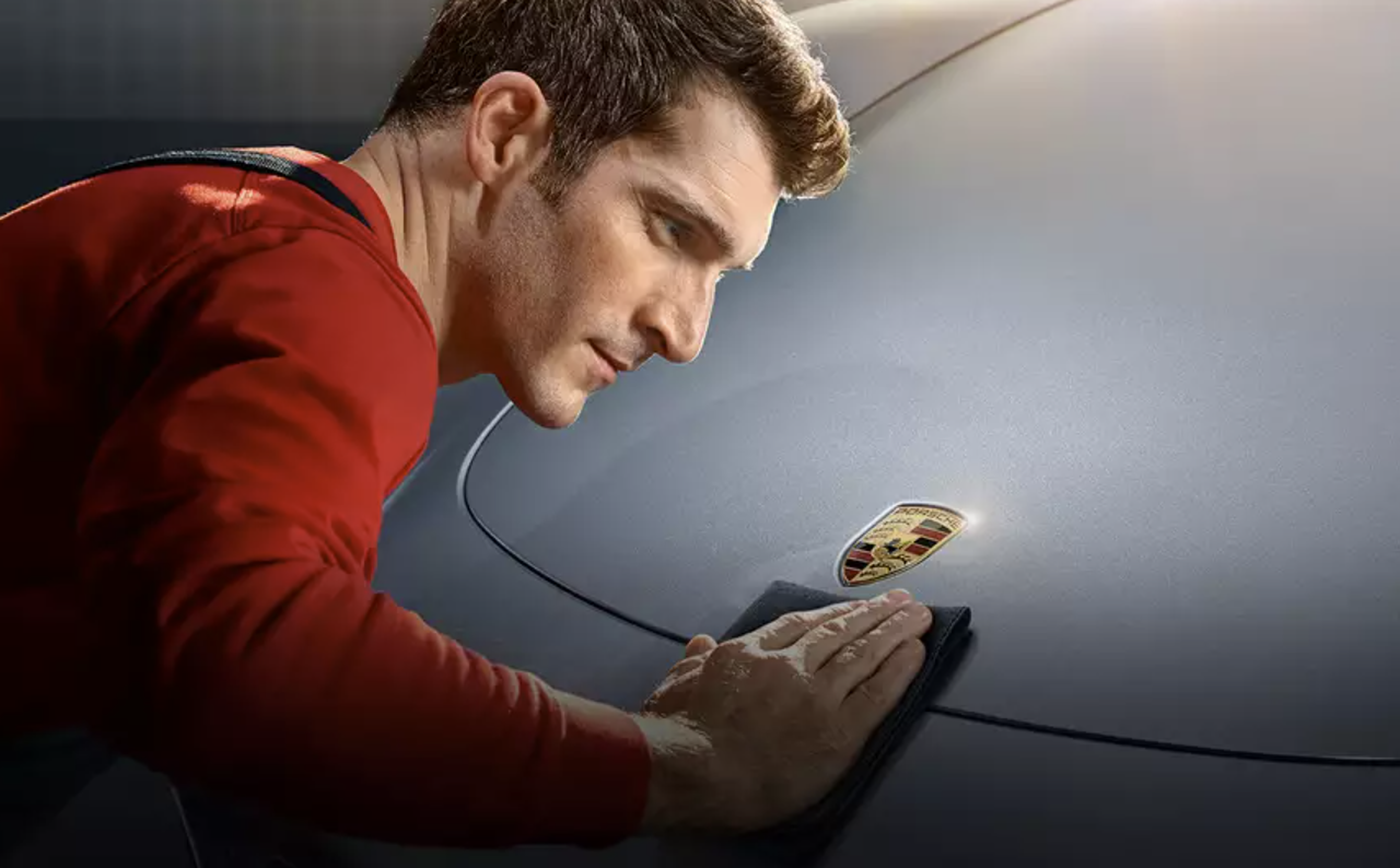 Porsche Service Technician Cleaning Vehicle - Feature Image