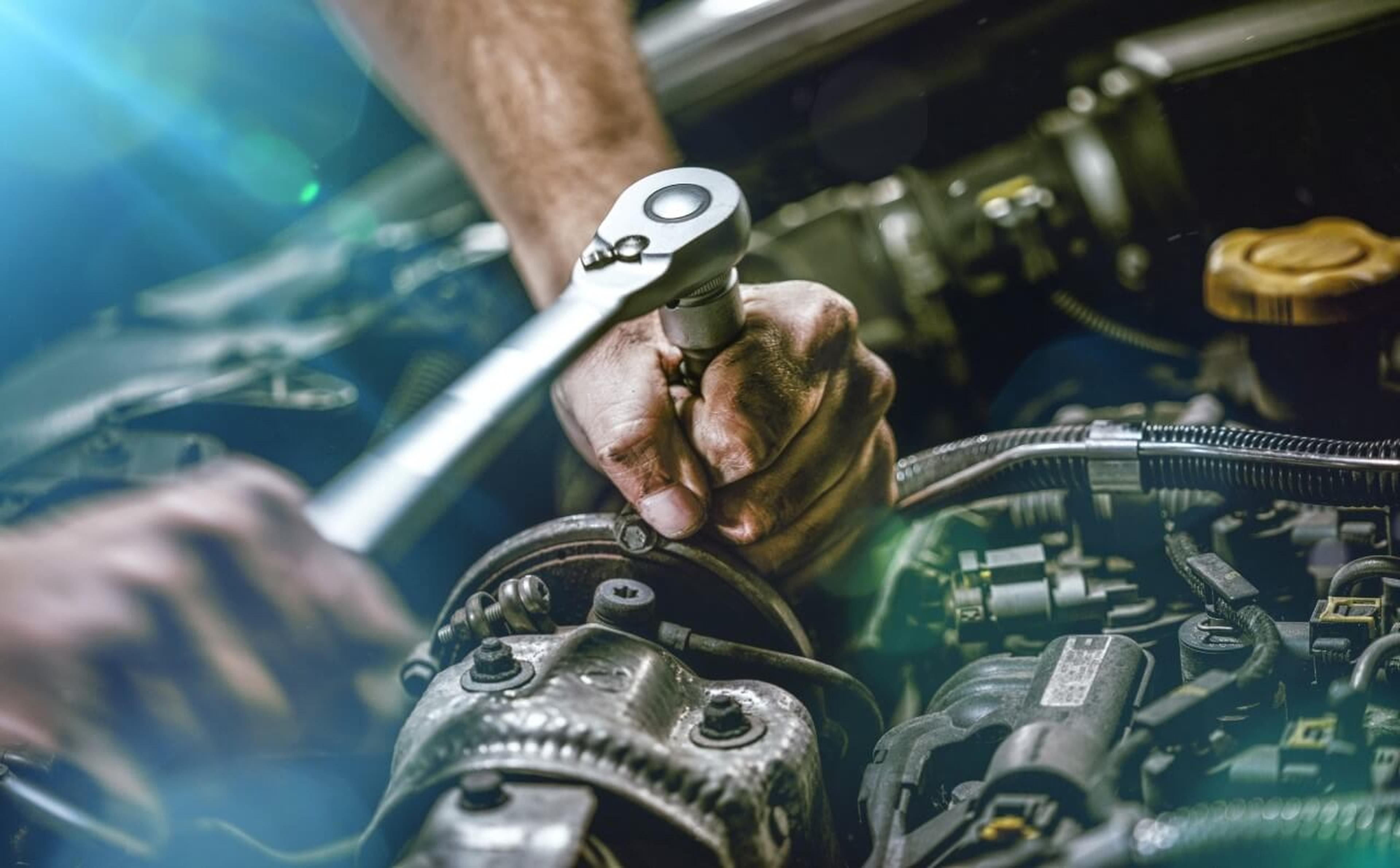 Service - Auto Mechanic Working on Car Engine"