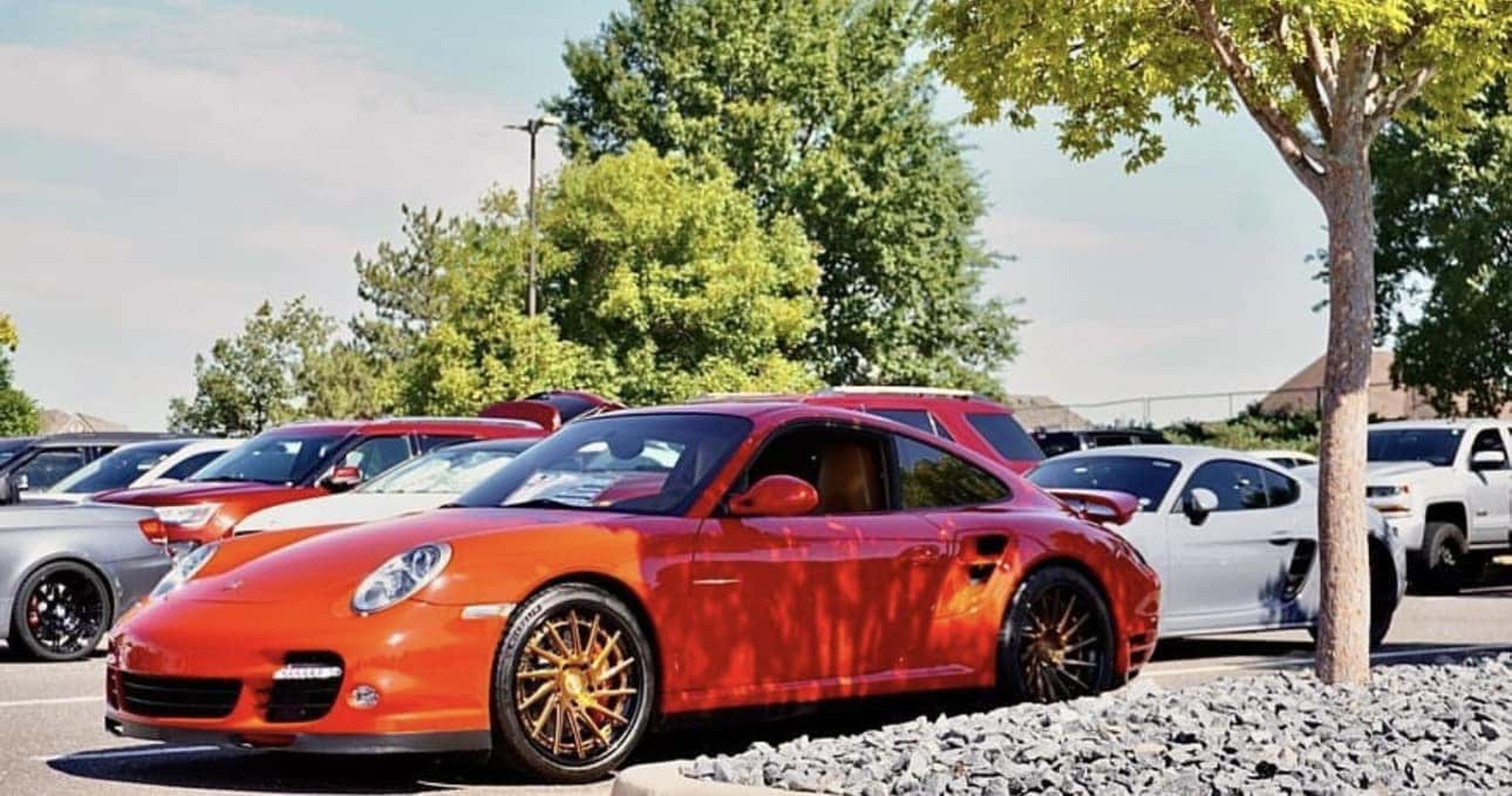 Red Porsche 911 parked at event