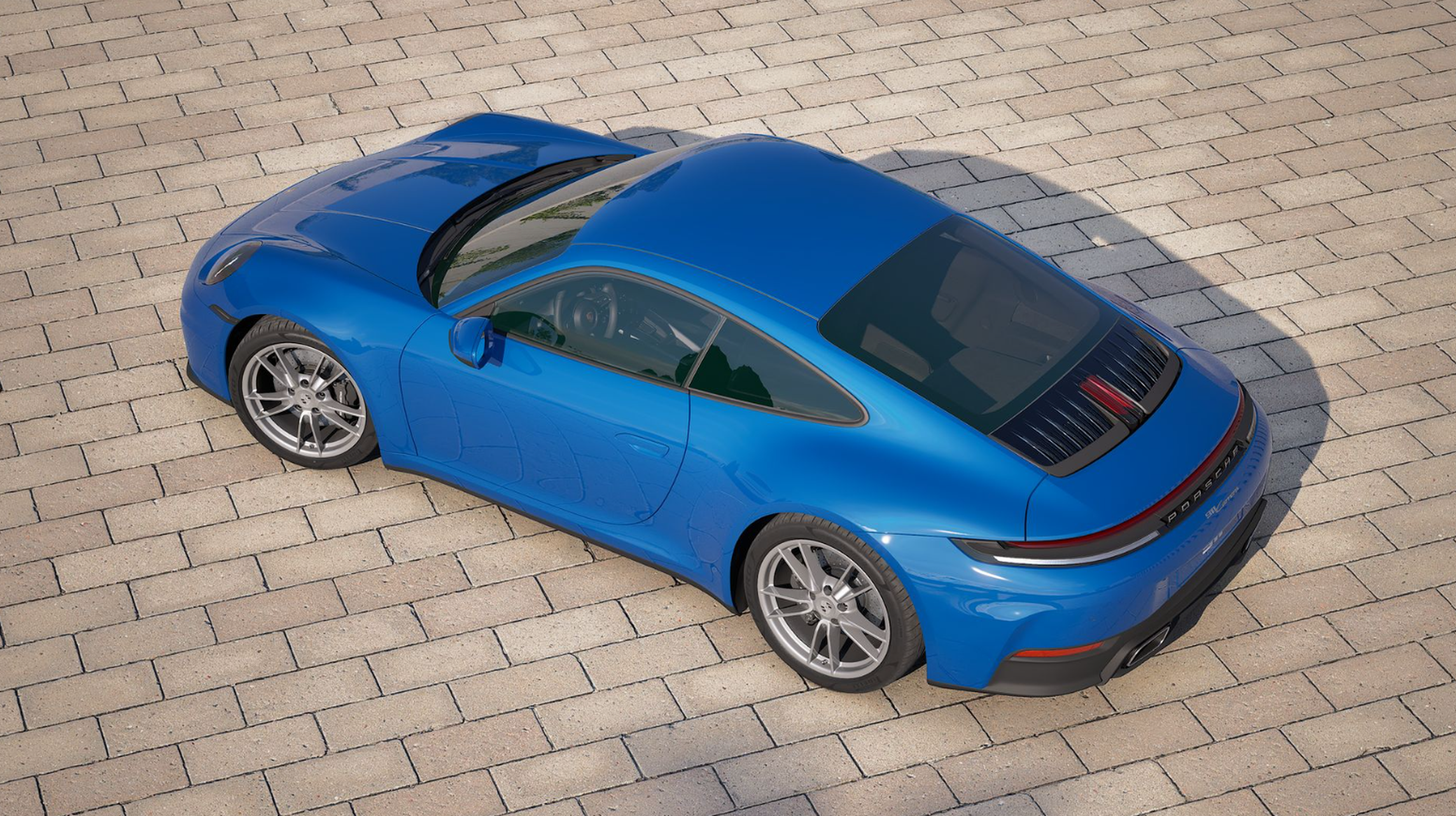 blue 2027 porsche 911 aerial shot