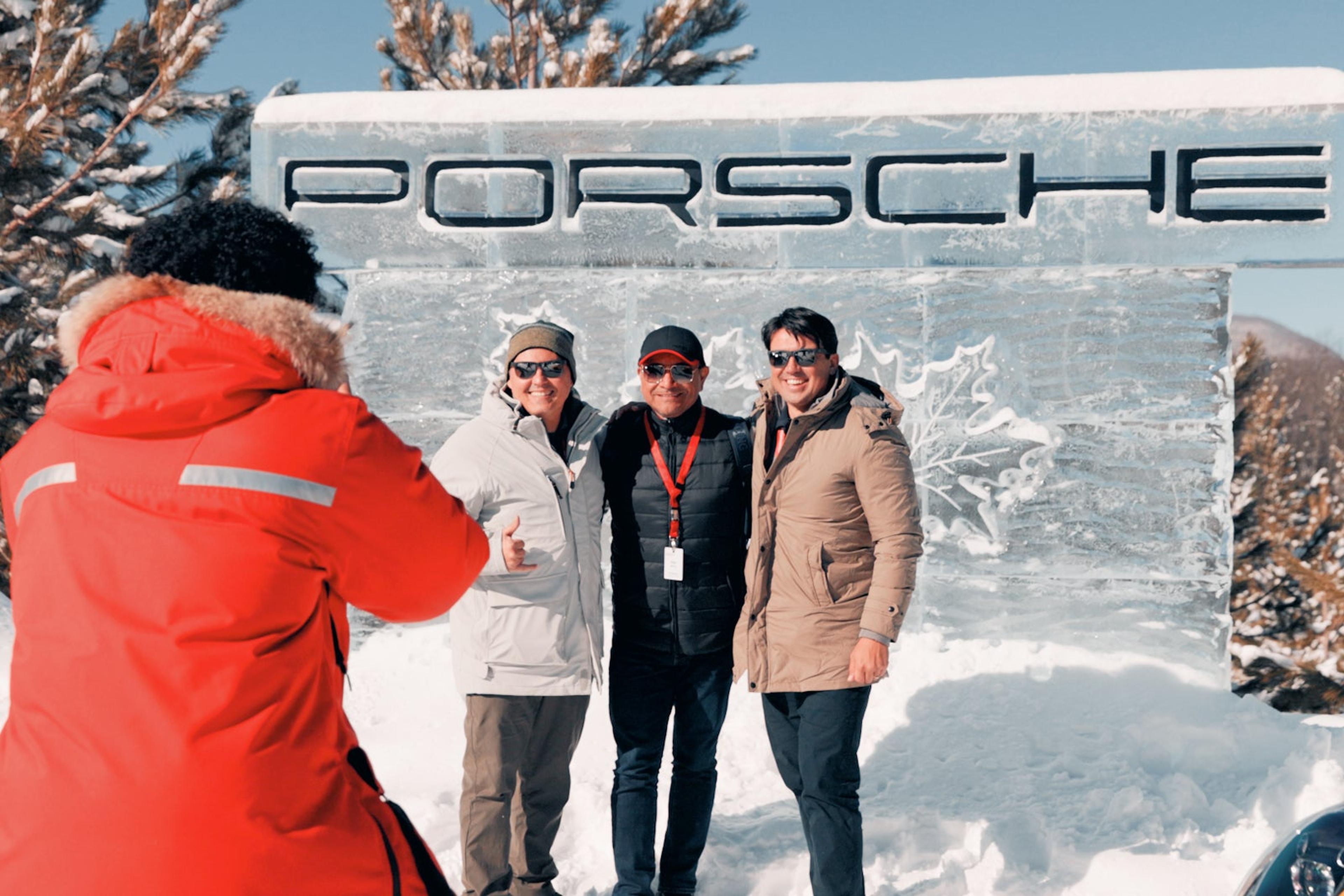 Porsche San Francisco guests in front of the Porsche sign at the Ice Experience