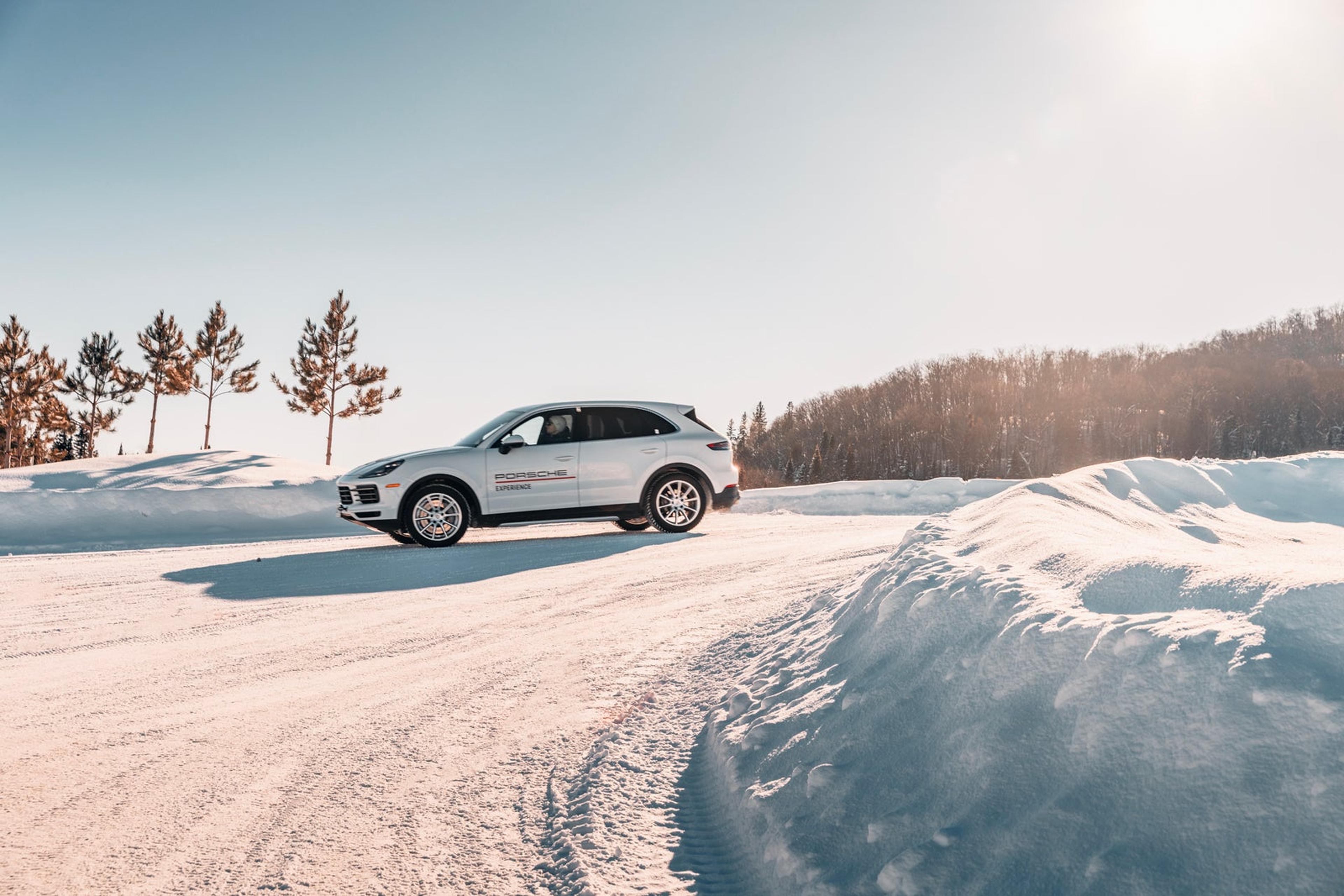 Porsche SUV on a snowy track in Canada