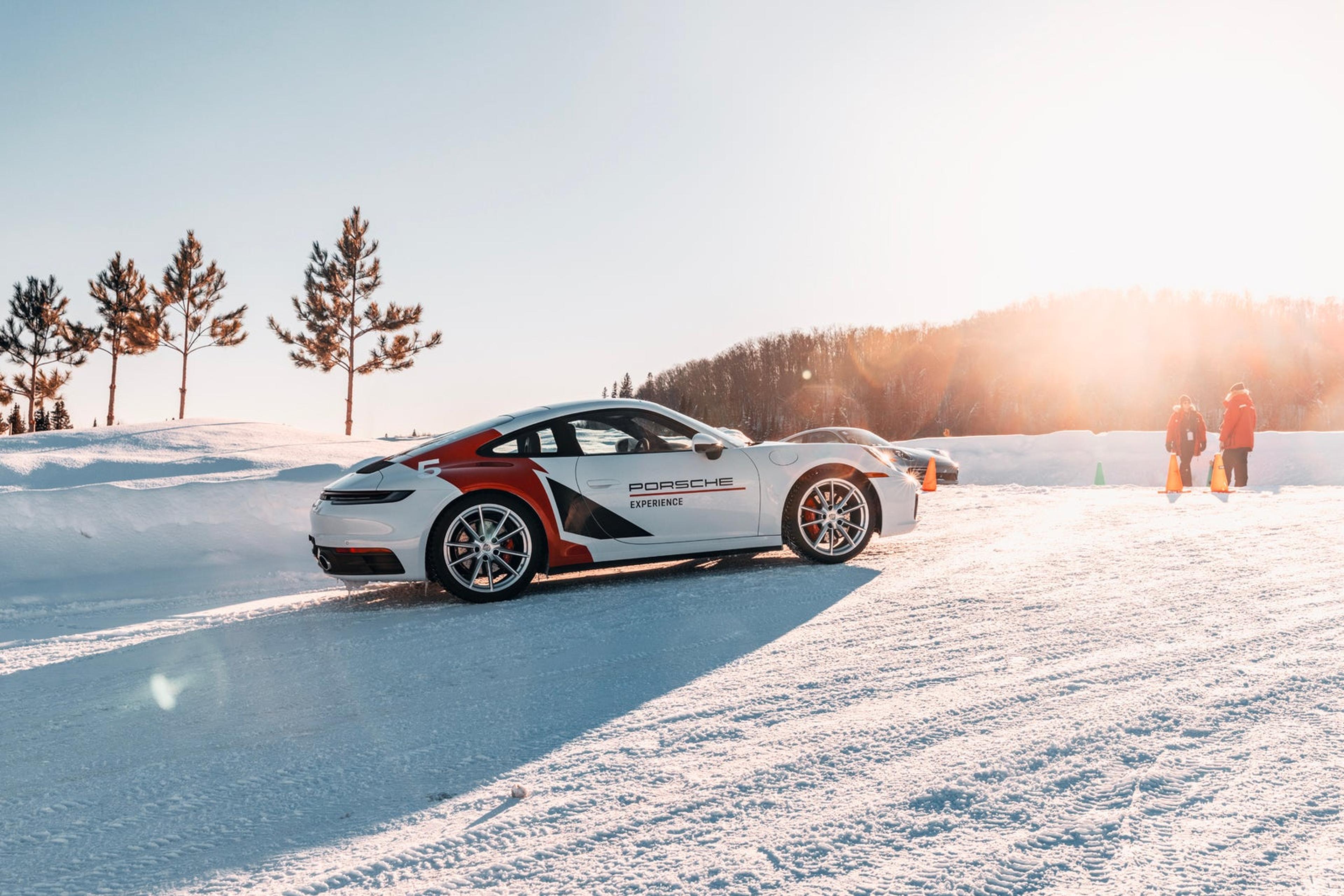 Porsche 911 with red racing livery on the snow track
