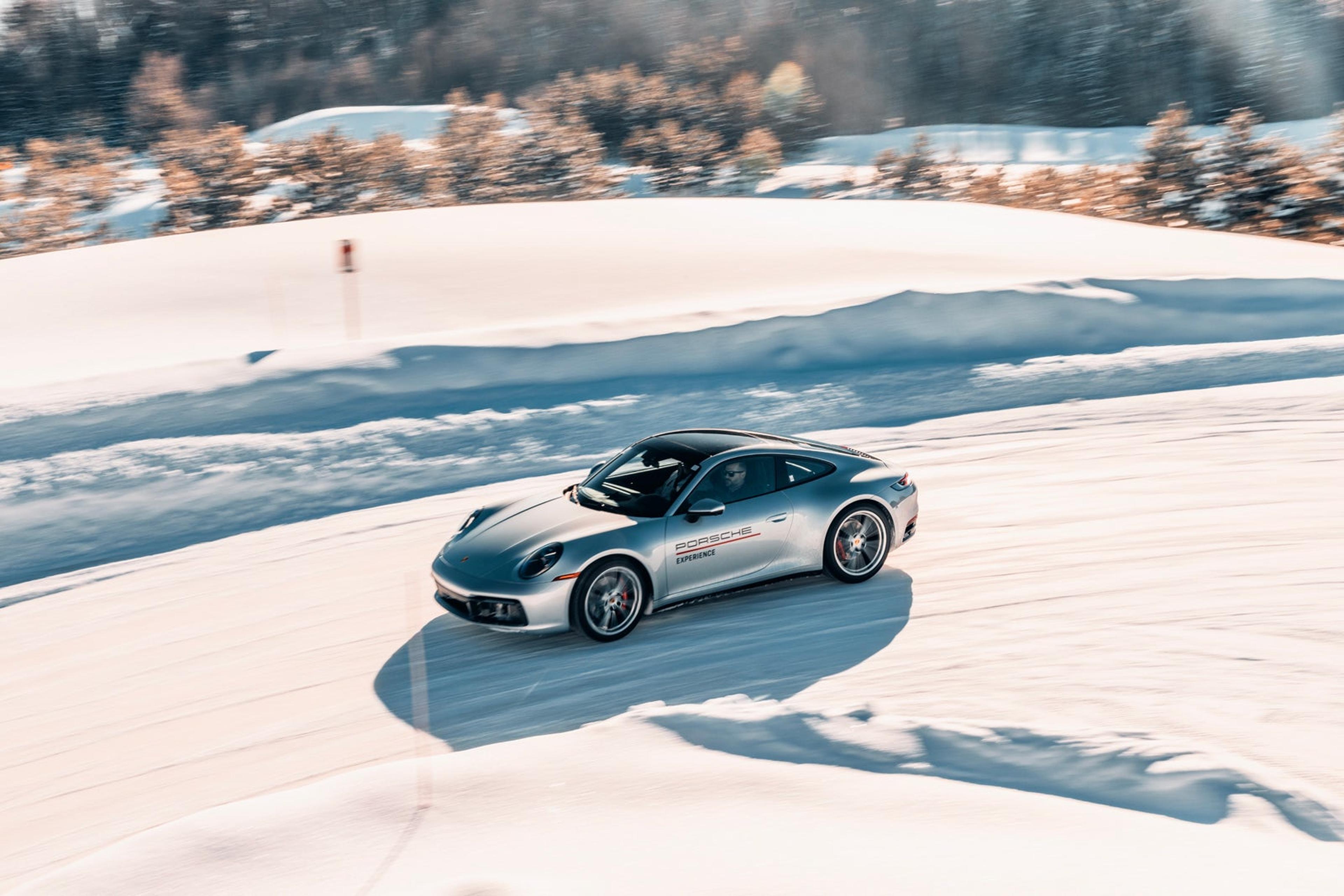 Porsche 911 sliding across a frozen lake at the Porsche Ice Experience