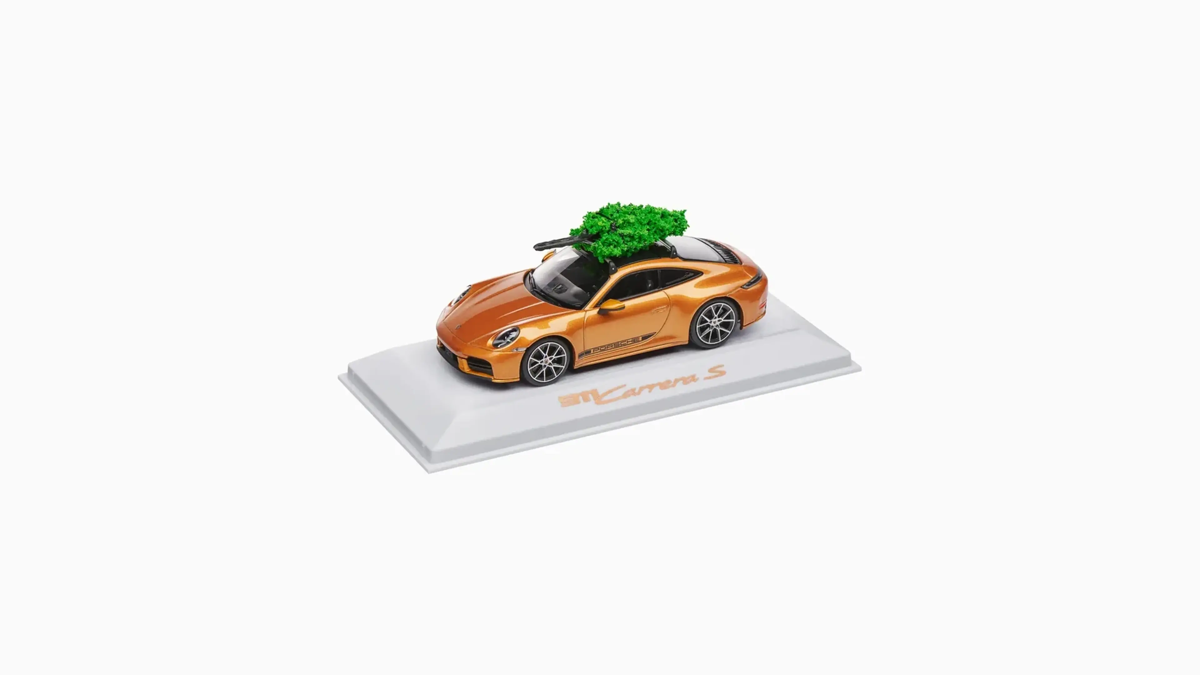 Nordic Gold Porsche 911 Carrera S scale model with a tree on the roof