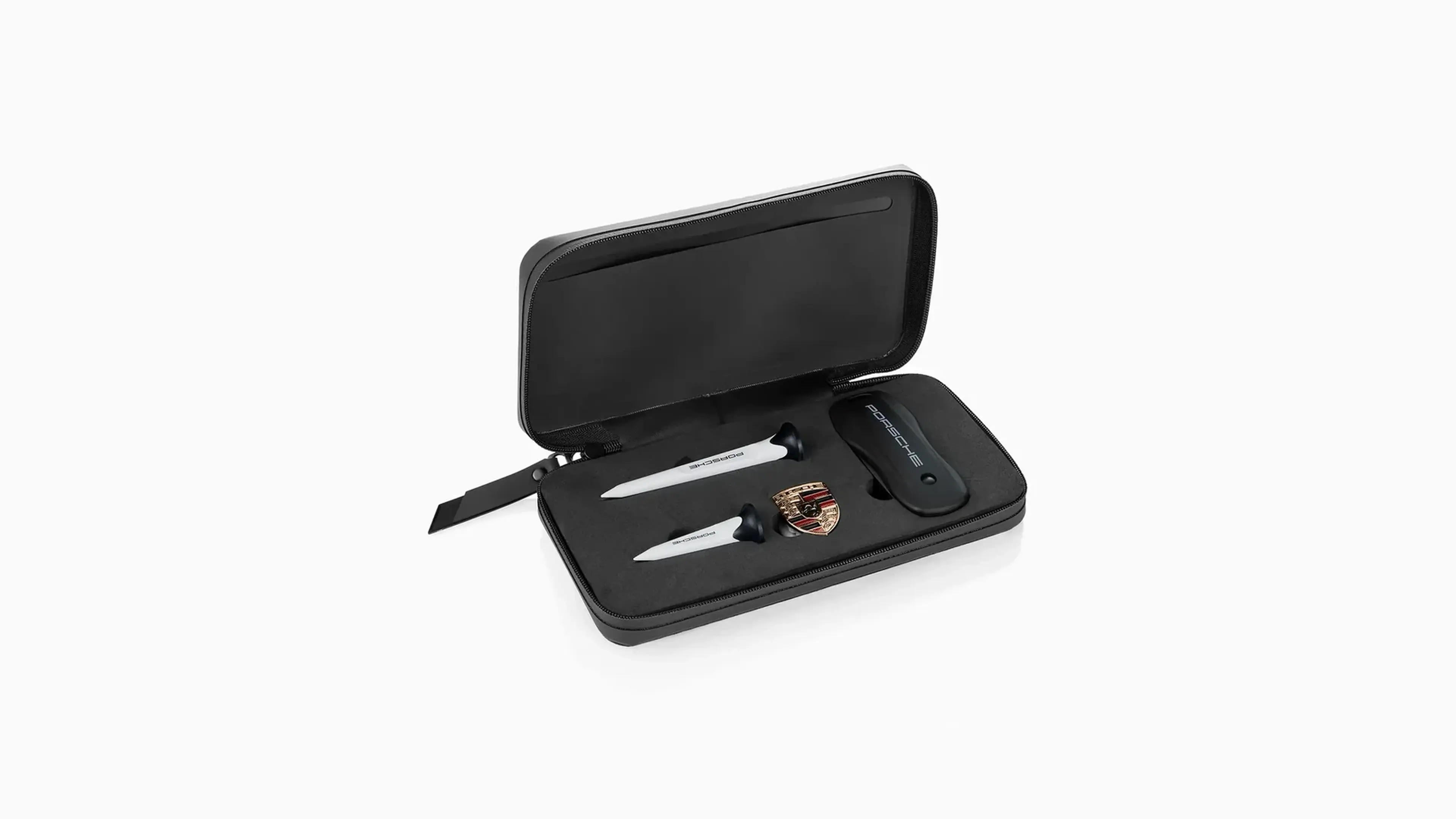 Porsche golf divot tool set displayed in its open case