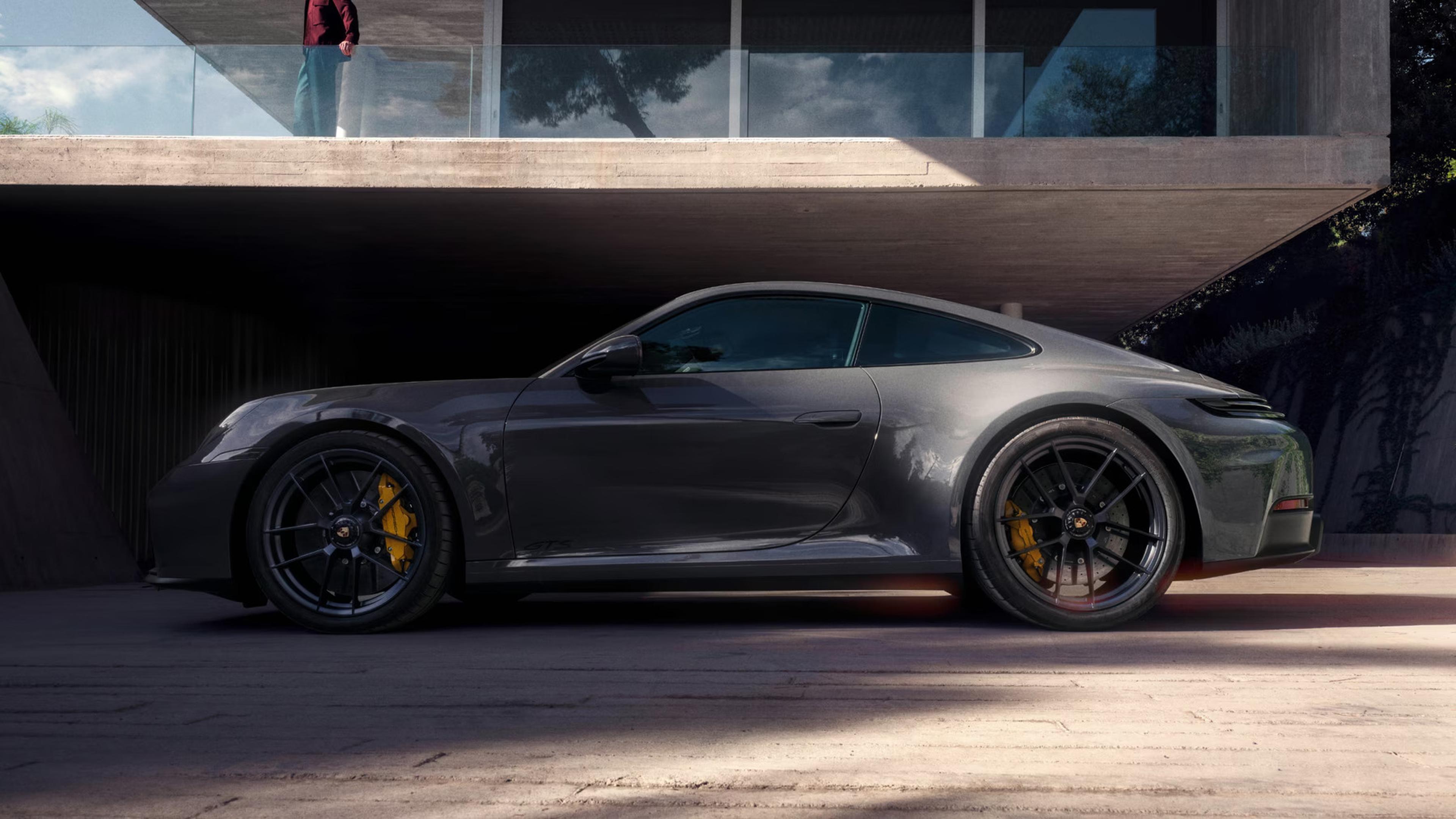 gray 2027 Porsche 911 Carrera parked next to a house