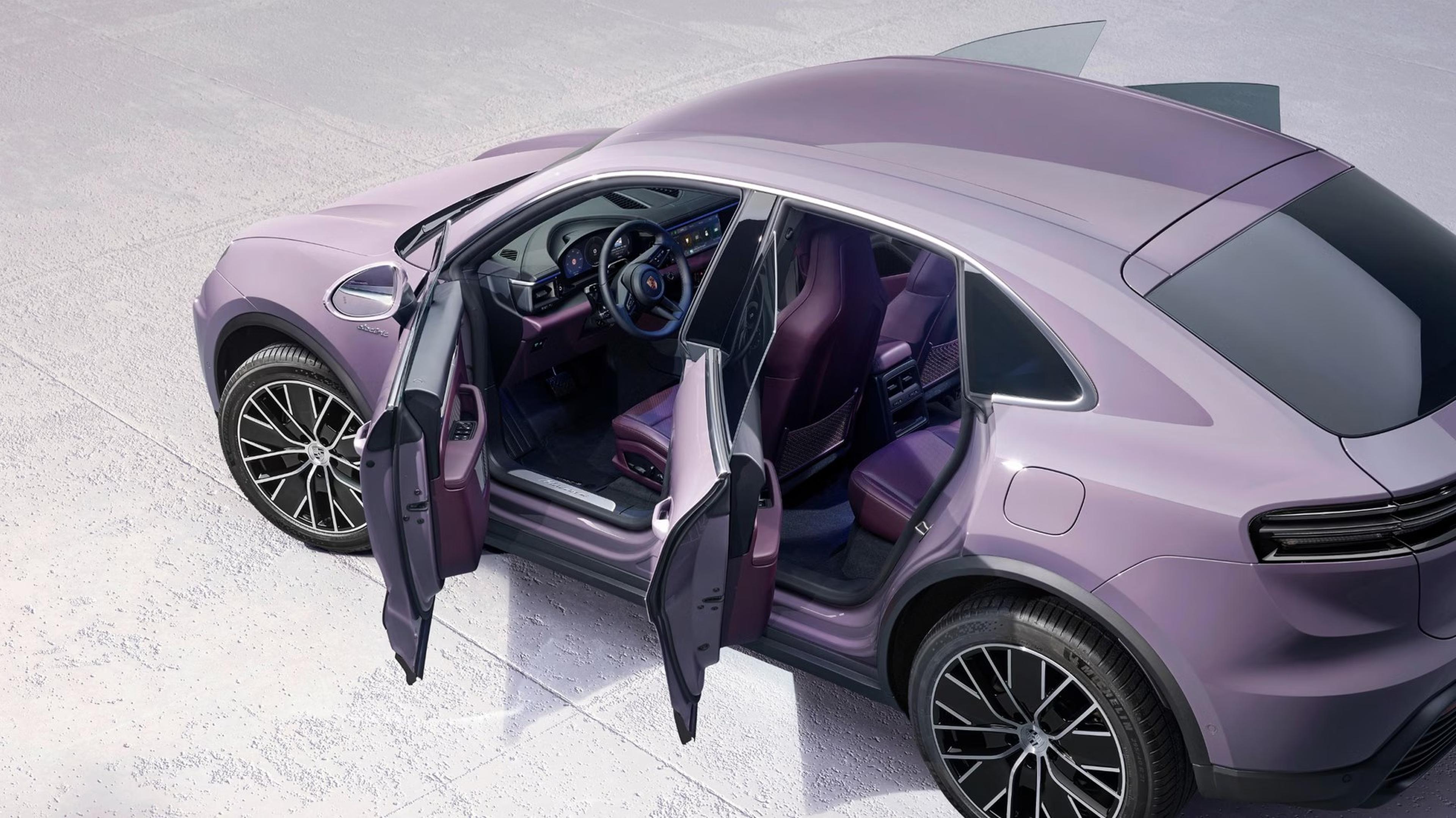 Purple Porsche Macan Electric with its doors open showing the spacious passenger cabin
