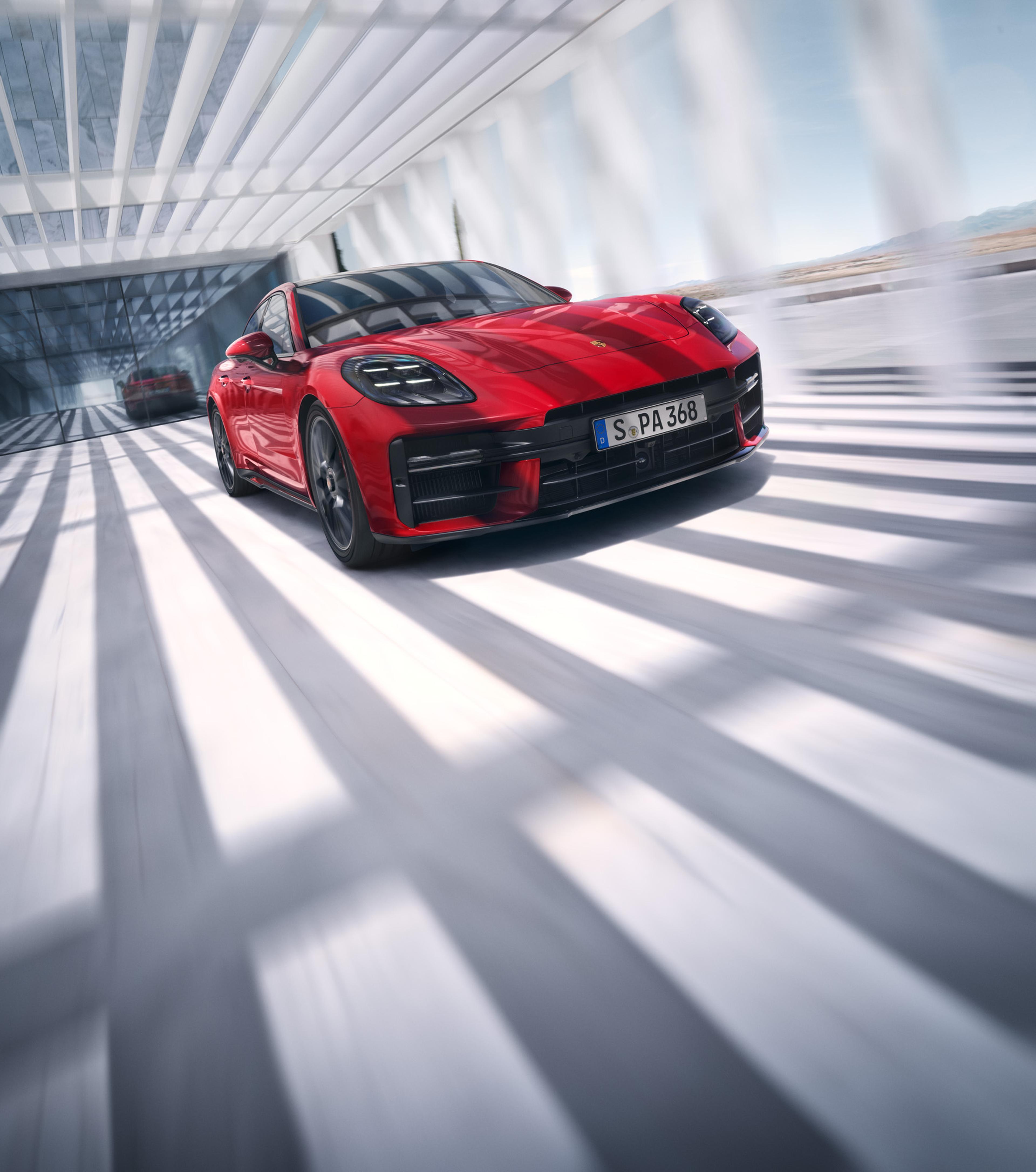 2024 Panamera GTS in Carmine Red with 21-inch Panamera Turbo S central locking wheels in Anthracite, and Grey Tinted HD-Matrix LED Headlights