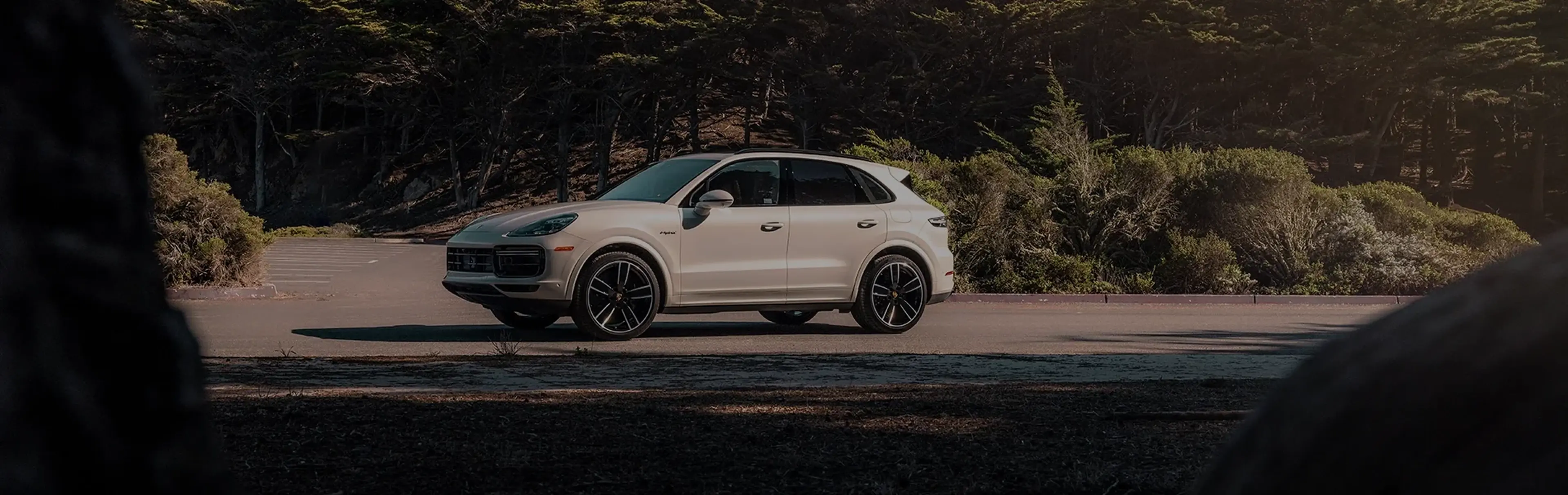 White Porsche Cayenne on a mountain road