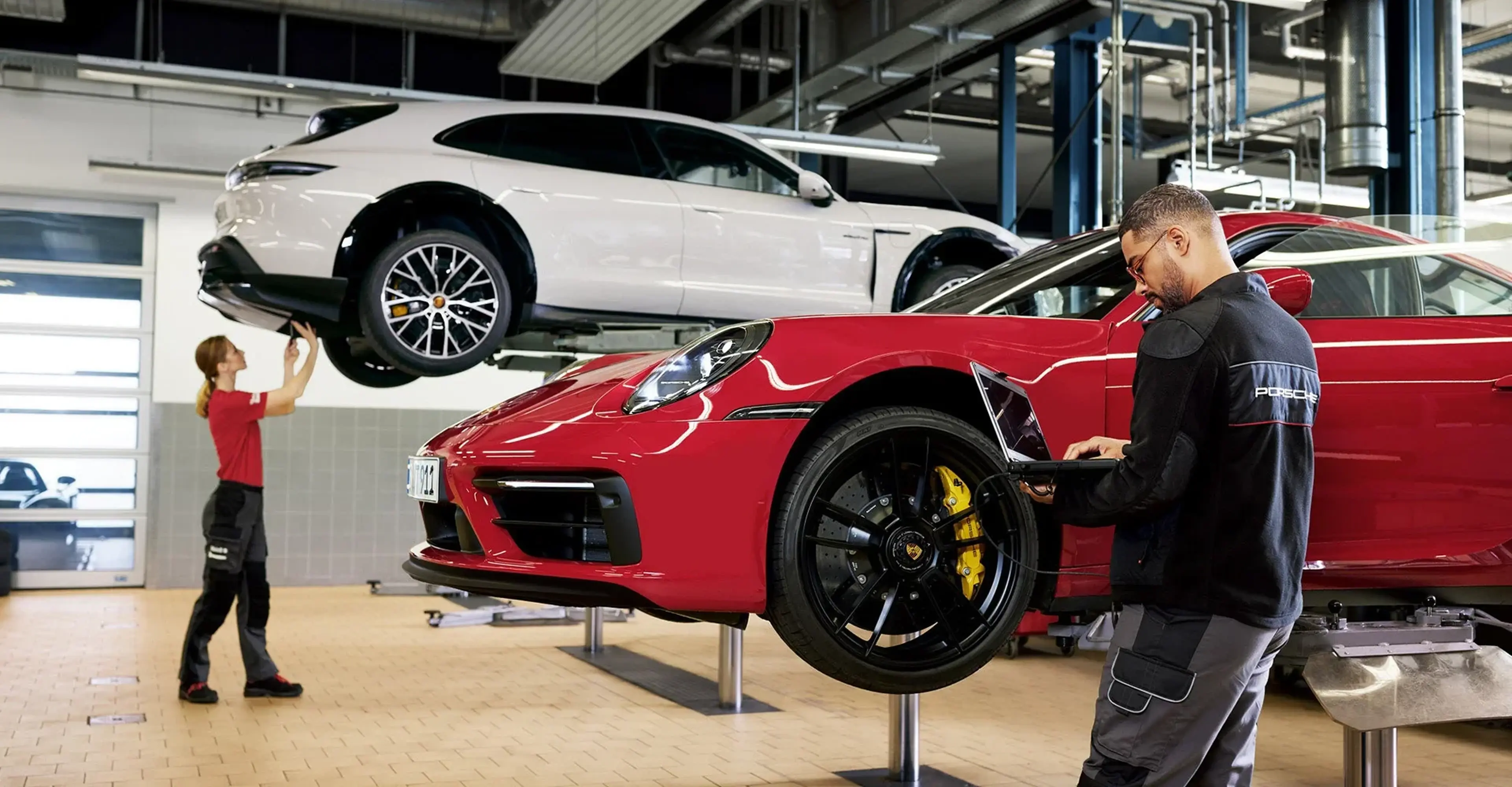 Red Porsche 911 on a service lift