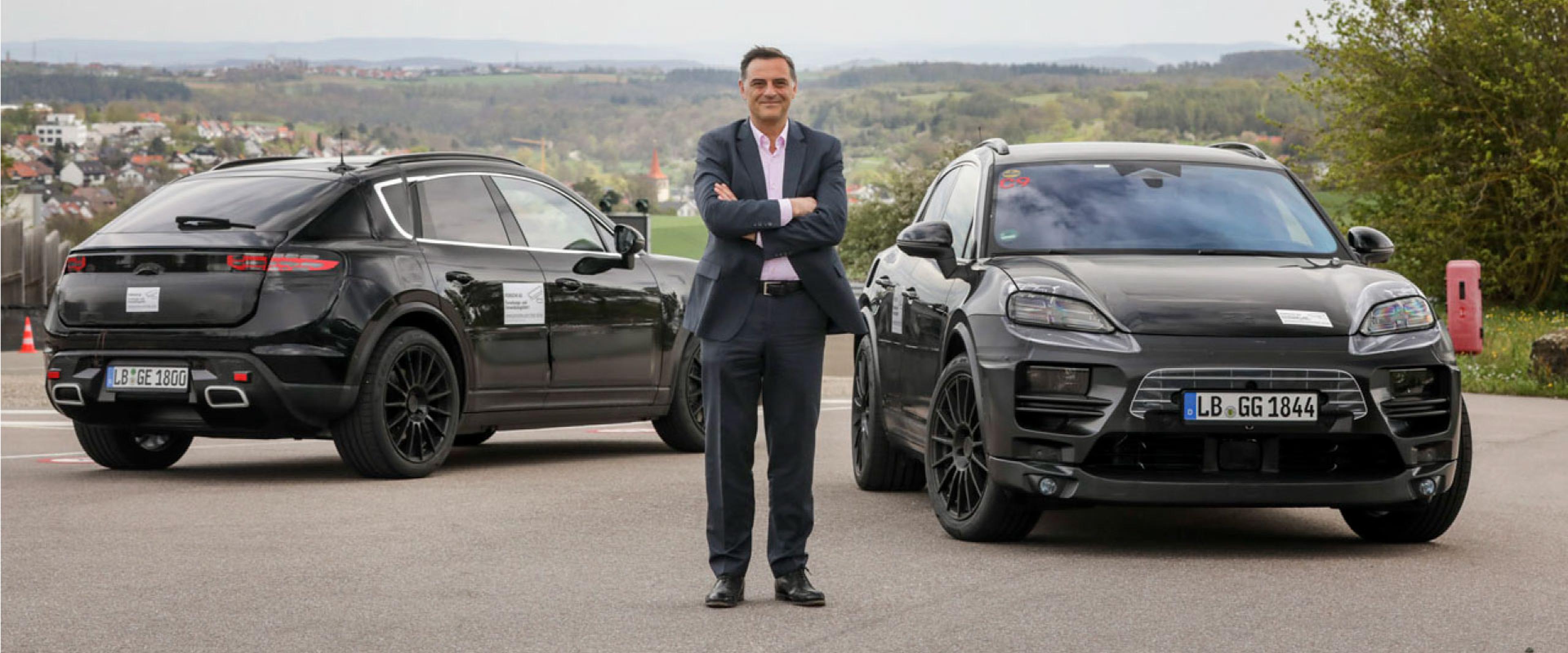 Michael Steiner member of Porsche research and development with the 2023 Porsche Macan EV prototype