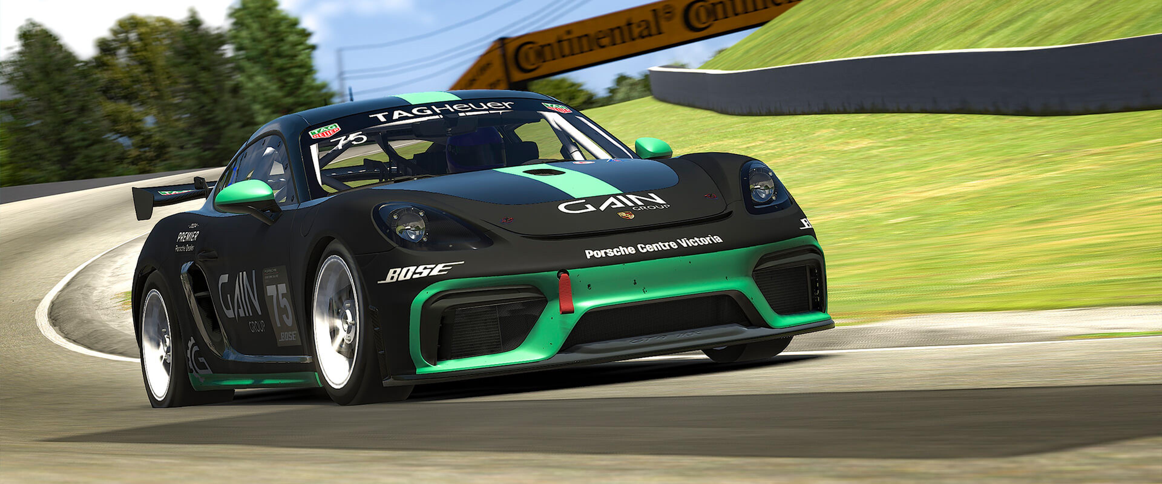 Video game rendering of a black and green Porsche GT4