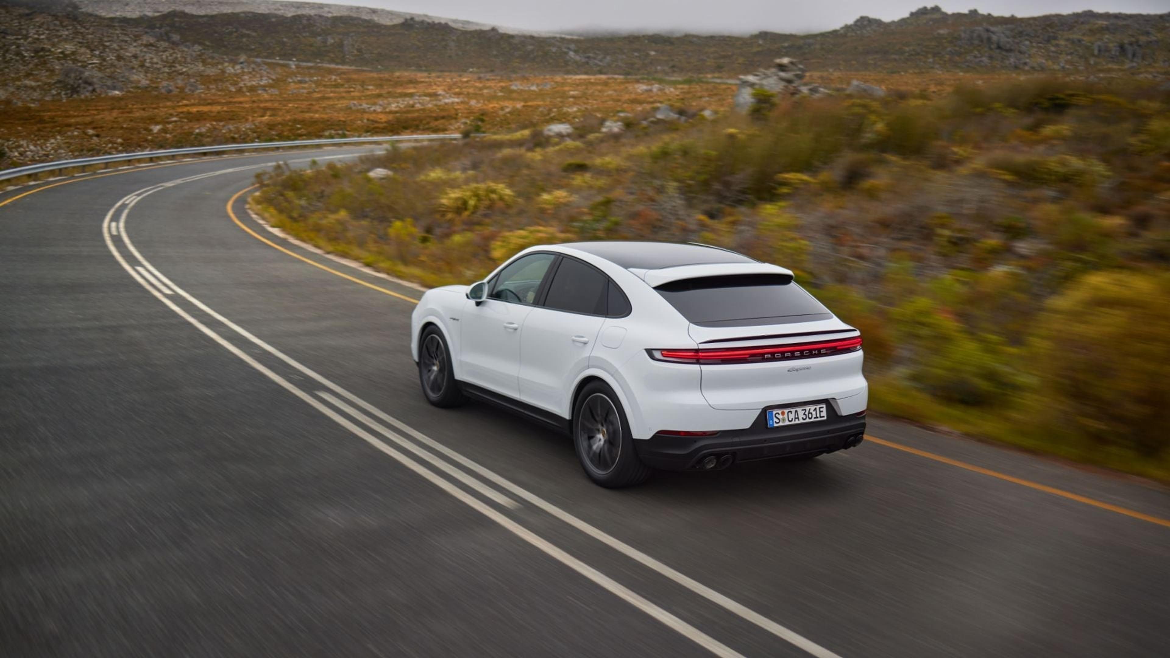 White Porsche Cayenne Coupe on the road