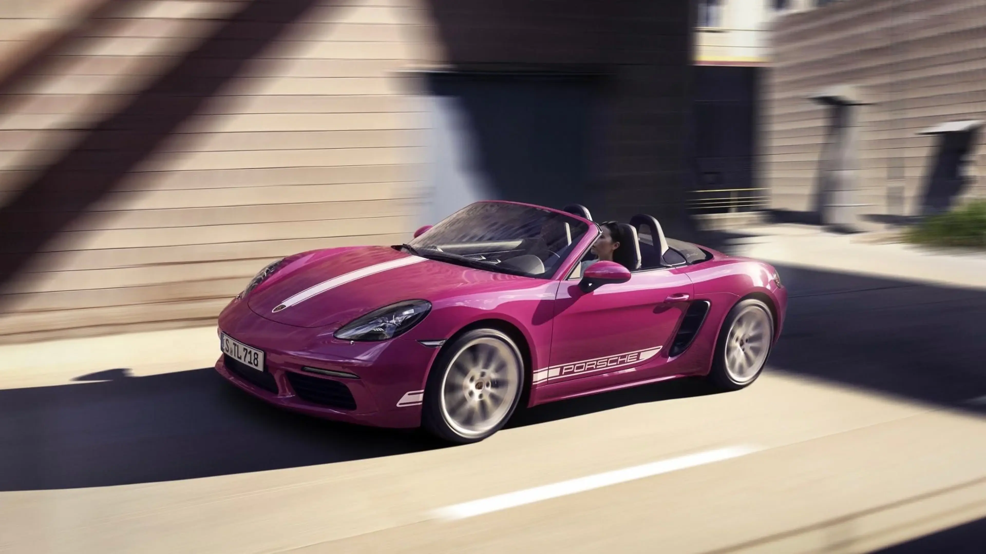 Magenta Porsche 718 Boxster front three-quarter view