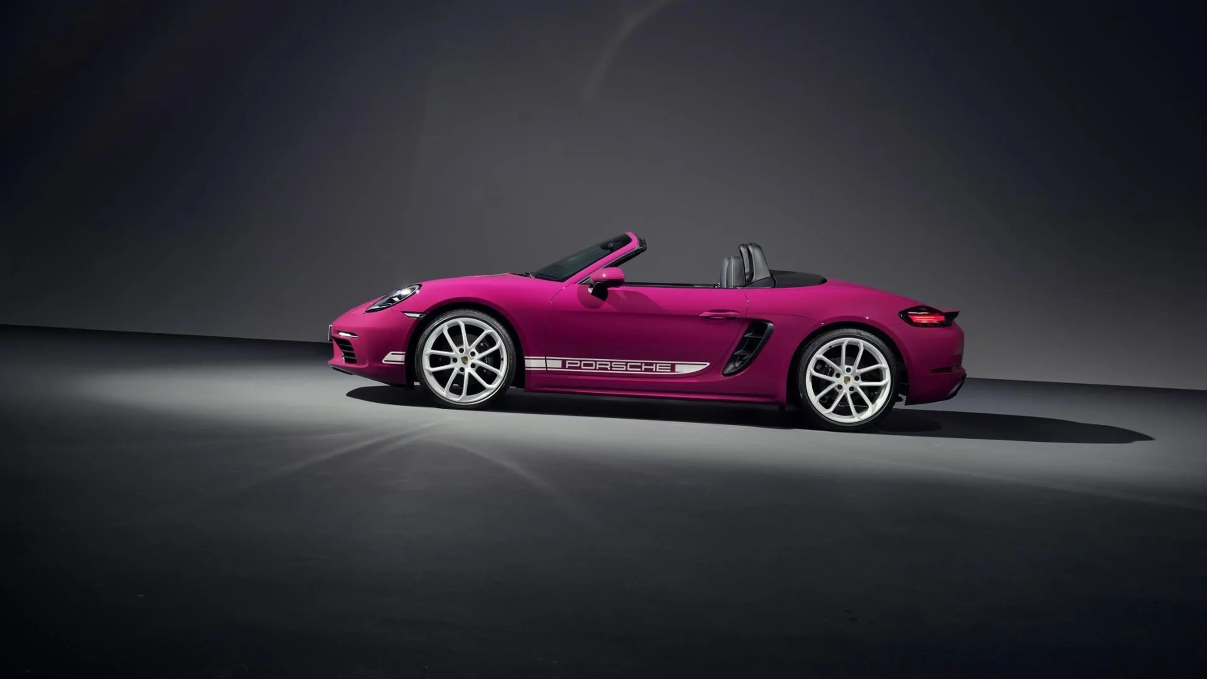 Magenta Porsche 718 Boxster side view