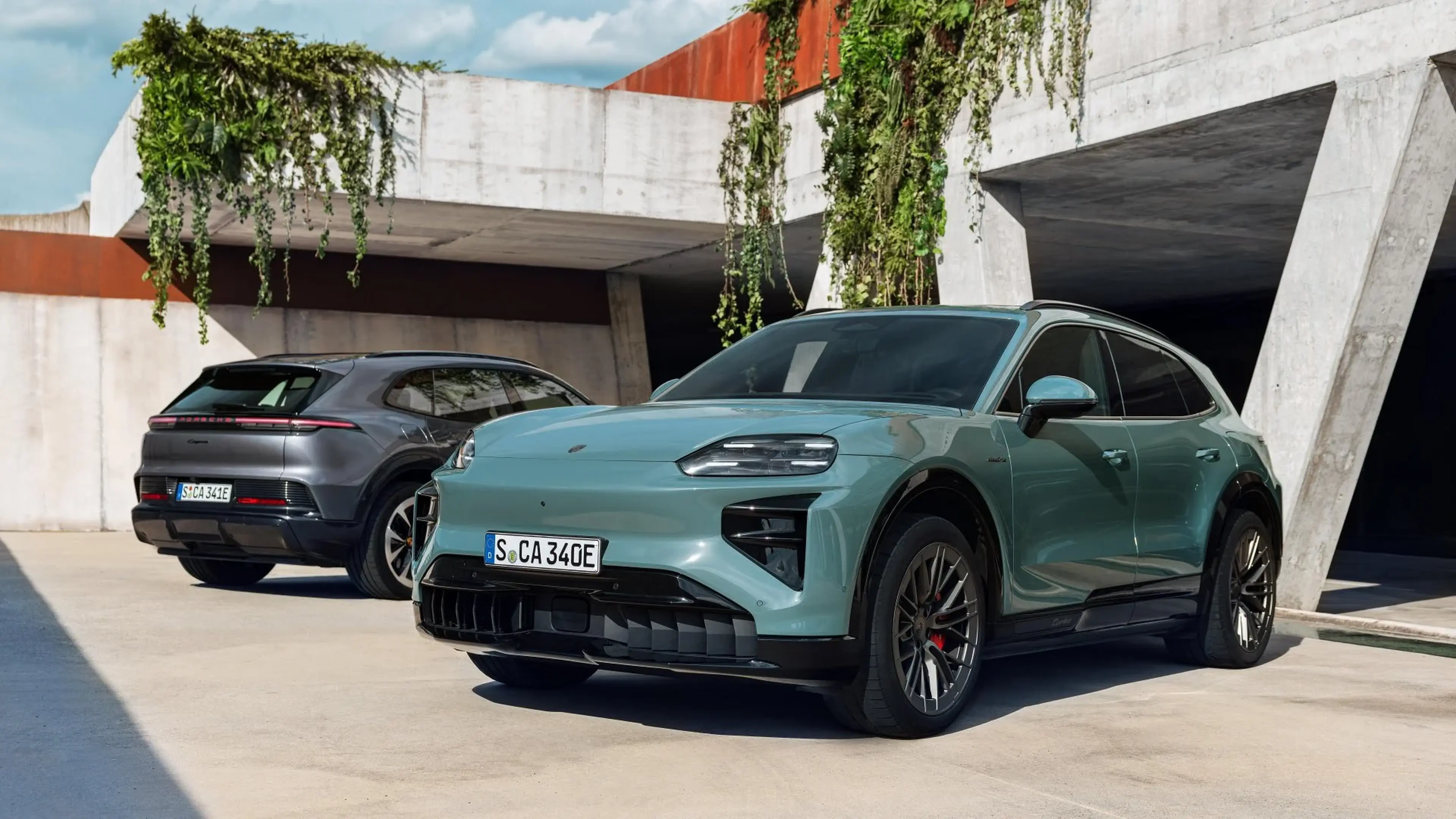 Green 2026 Porsche Cayenne Electric in a courtyard