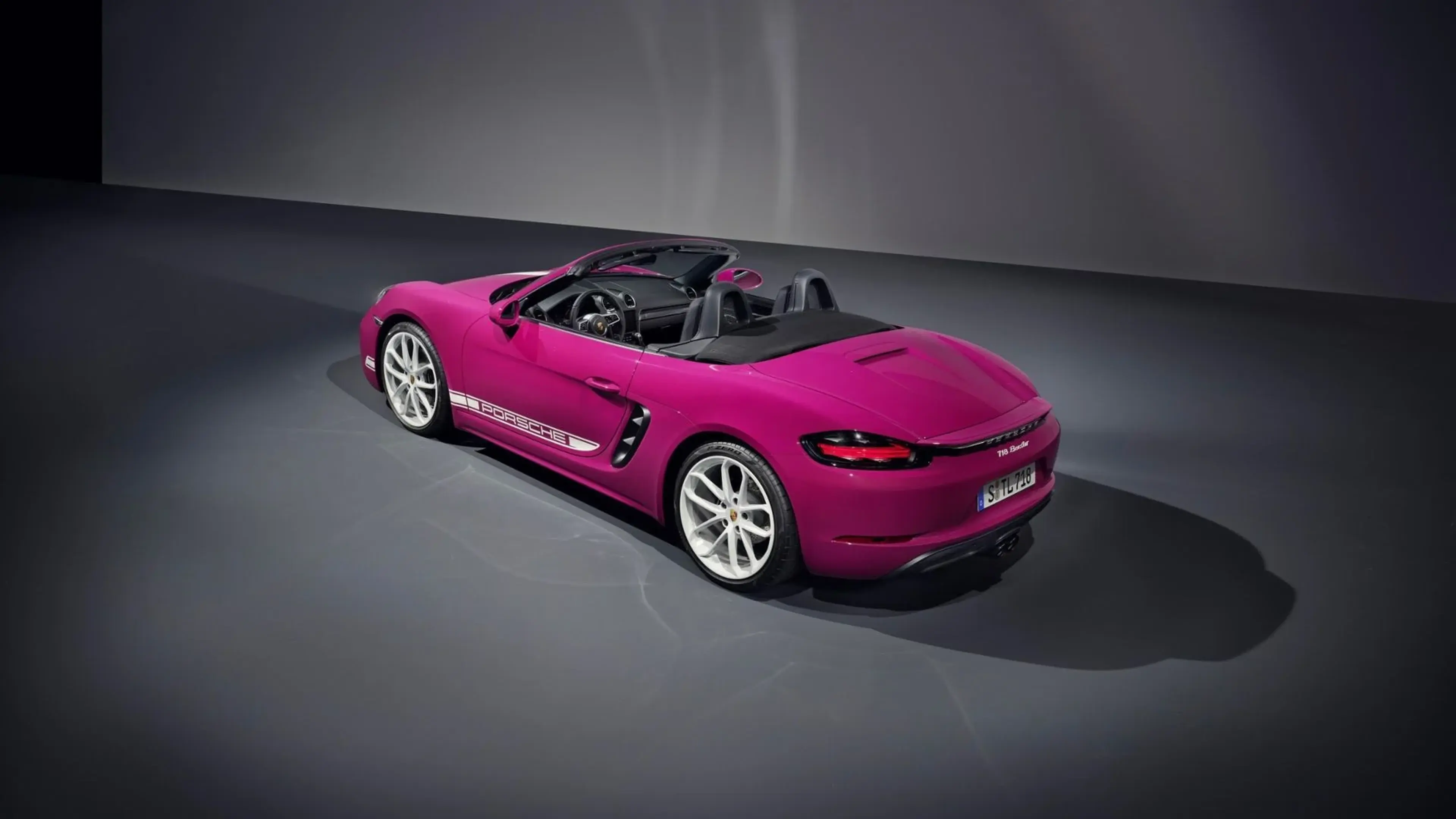 Magenta Porsche 718 Boxster convertible