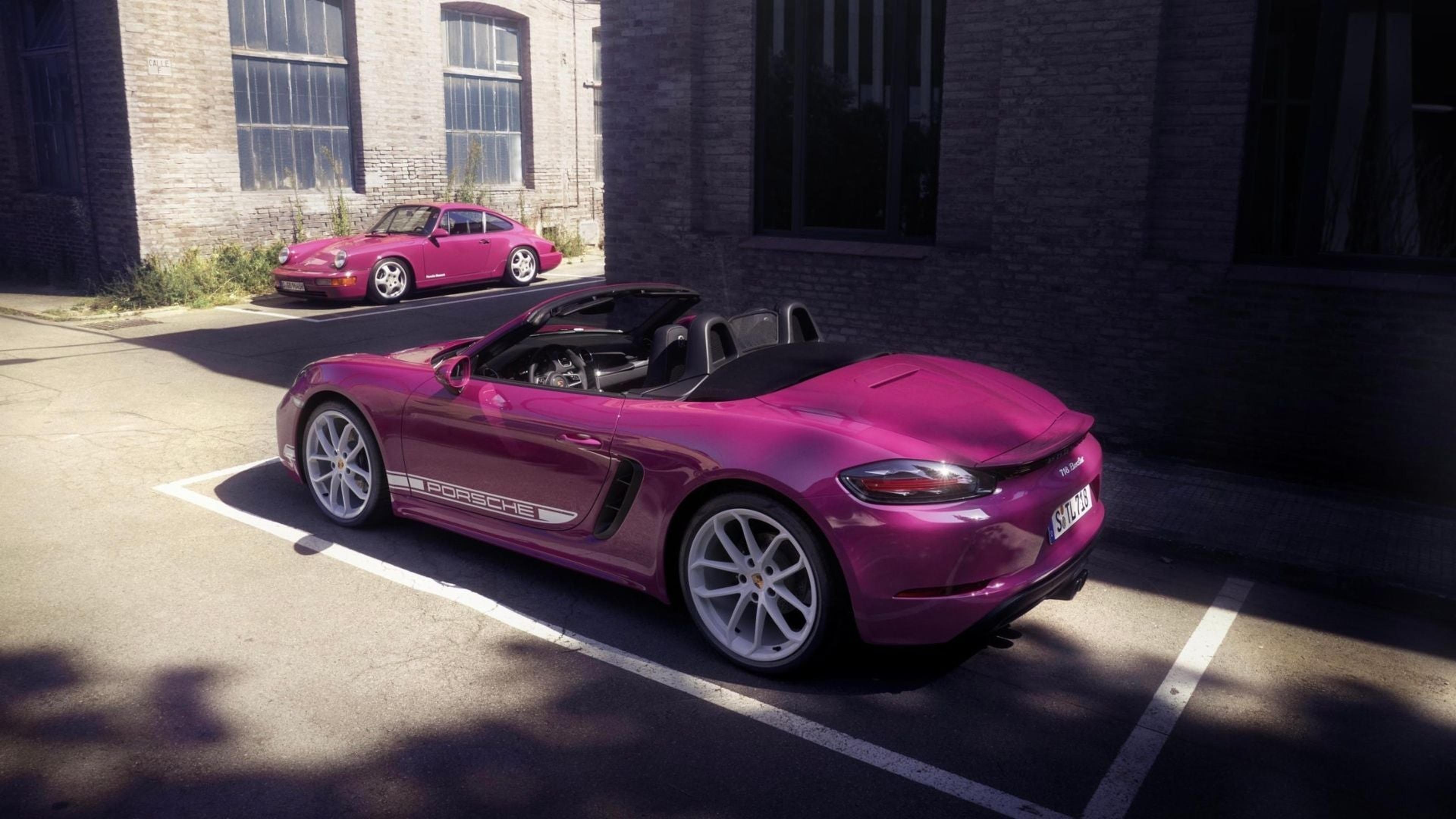Magenta Porsche 718 Boxster rear three-quarter view