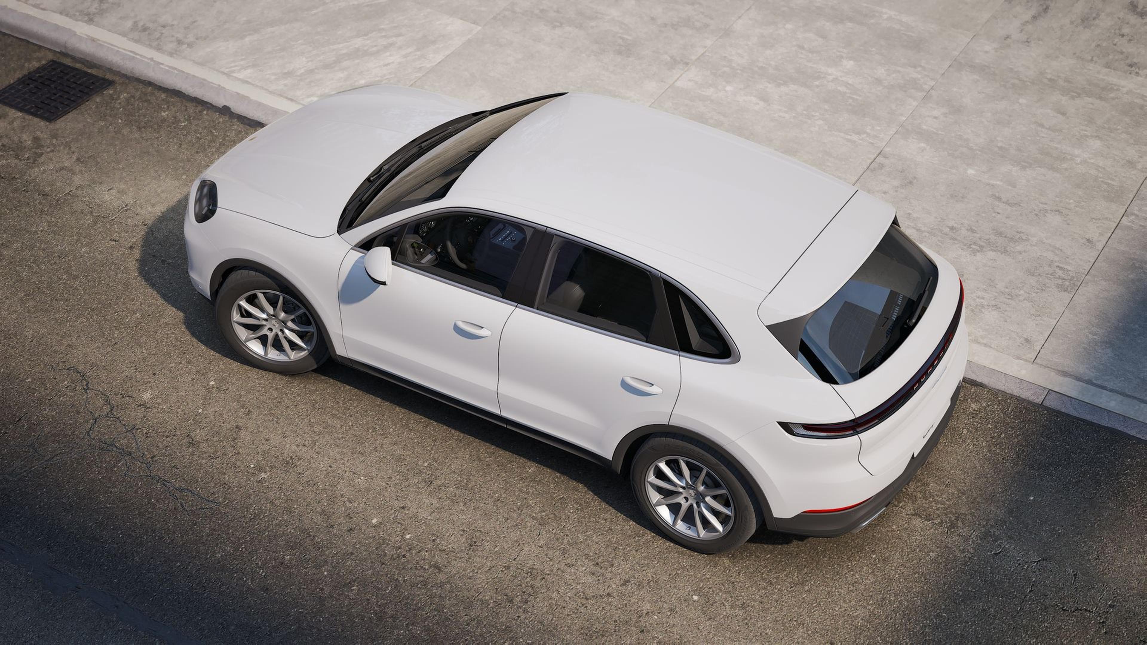 Overhead view highlighting the roof and rear spoiler design in a Porsche Cayenne and Cayenne Coupe comparison