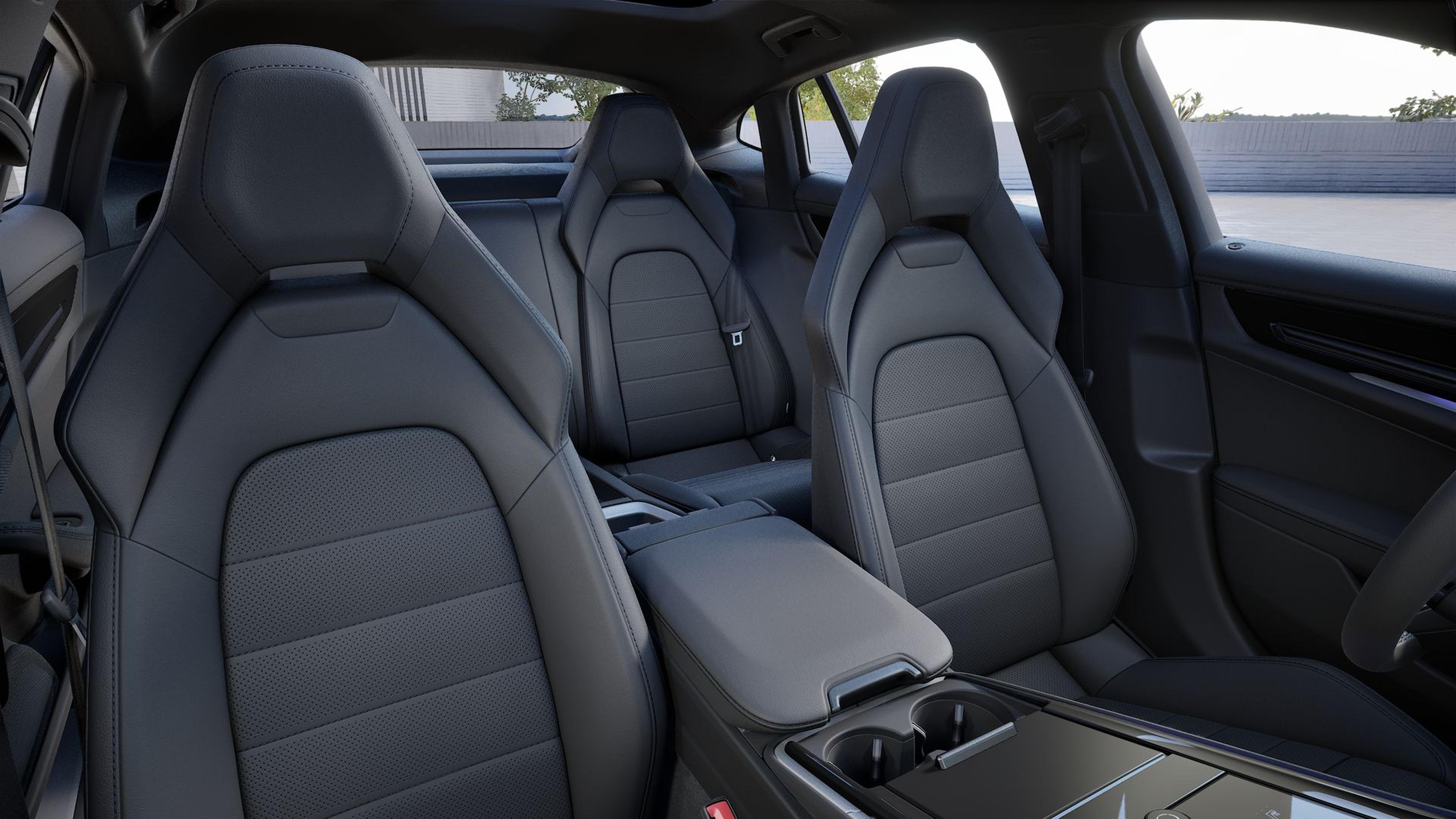 Interior of a car showing four sleek, modern leather seats with a central console, in a dark, minimalistic color scheme.