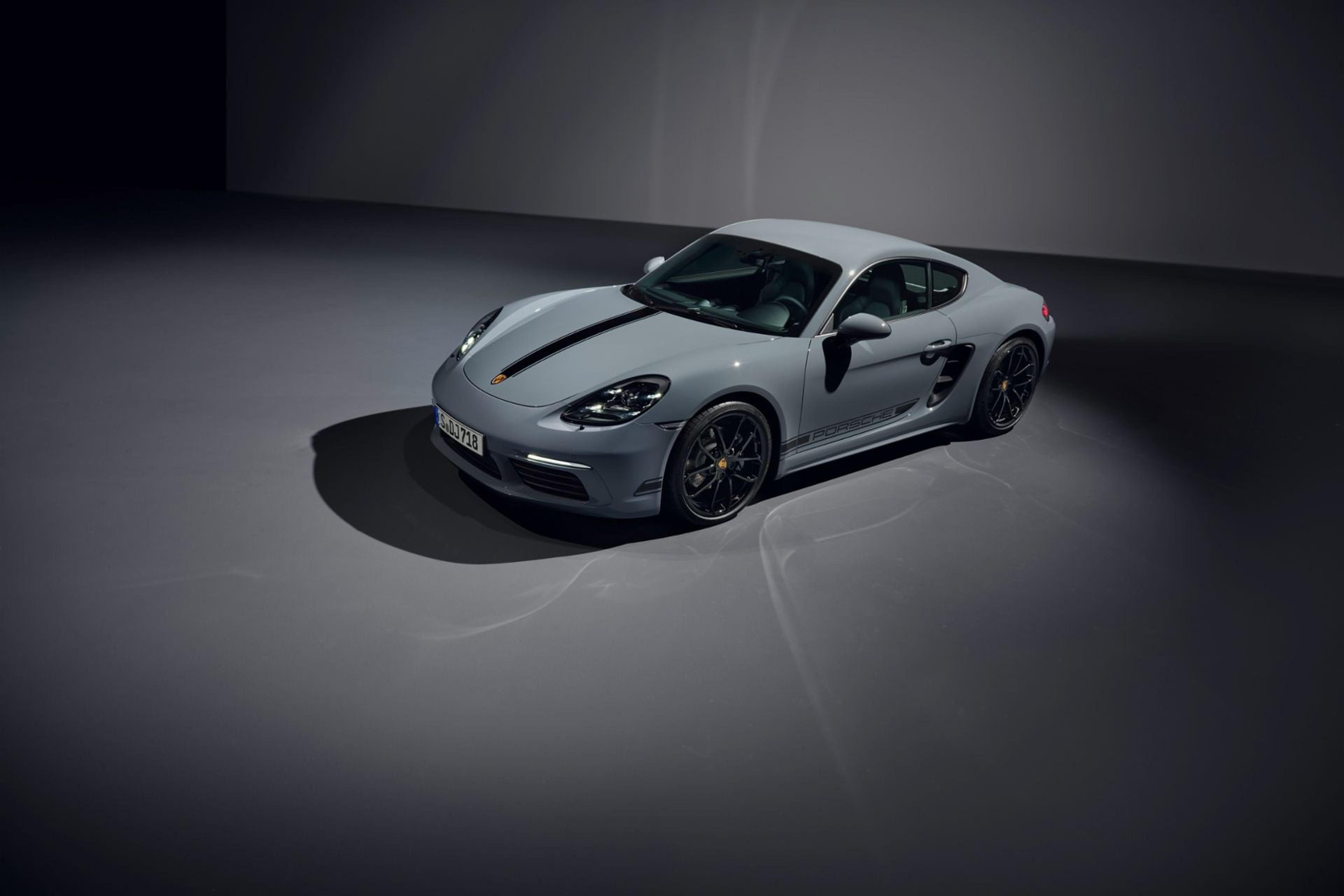 Gray Porsche 718 Cayman seen from above in a studio