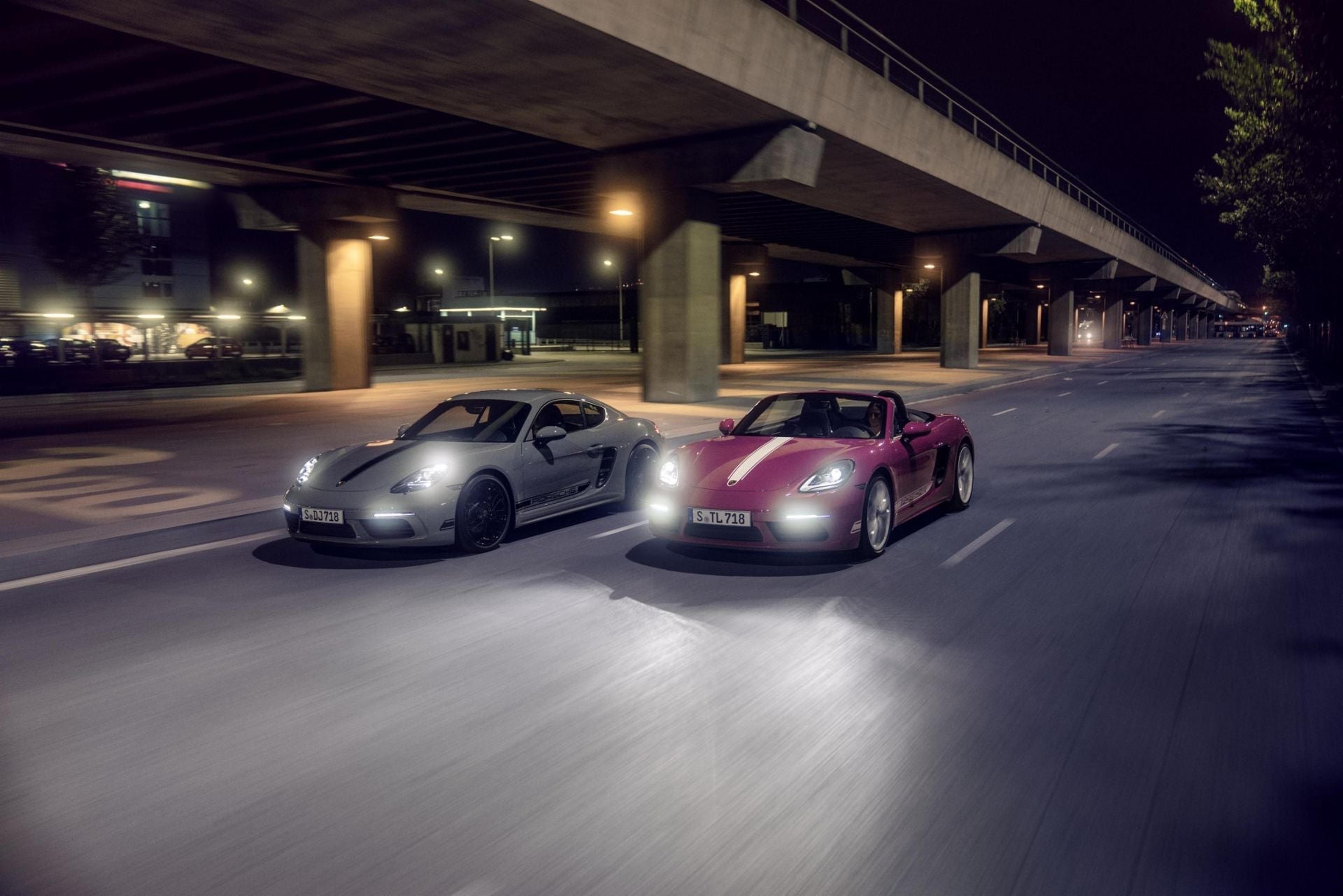 Porsche 718 models at night under a city overpass