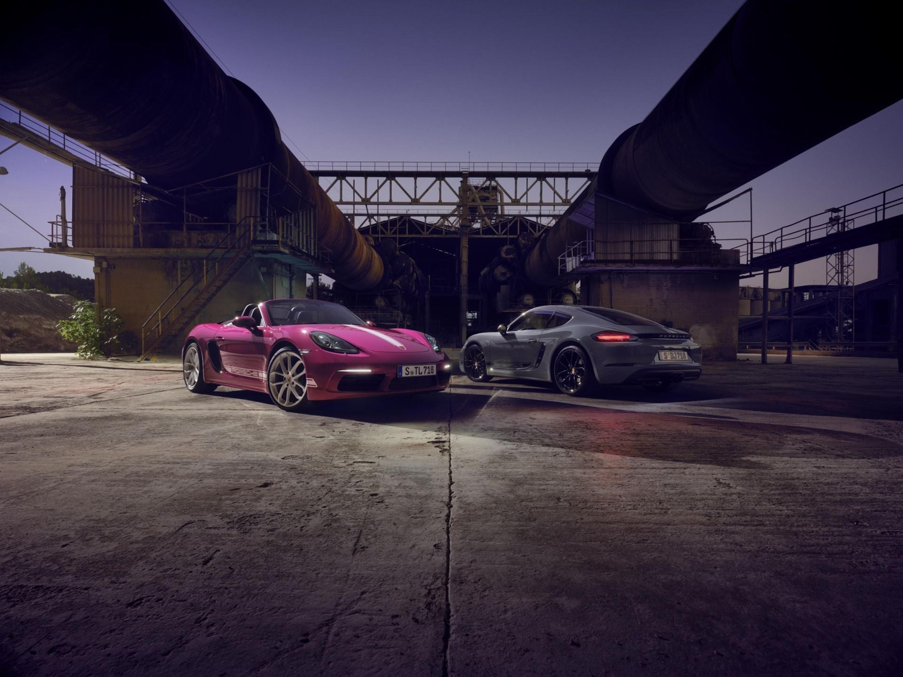 Porsche 718 Cayman coupes at dusk
