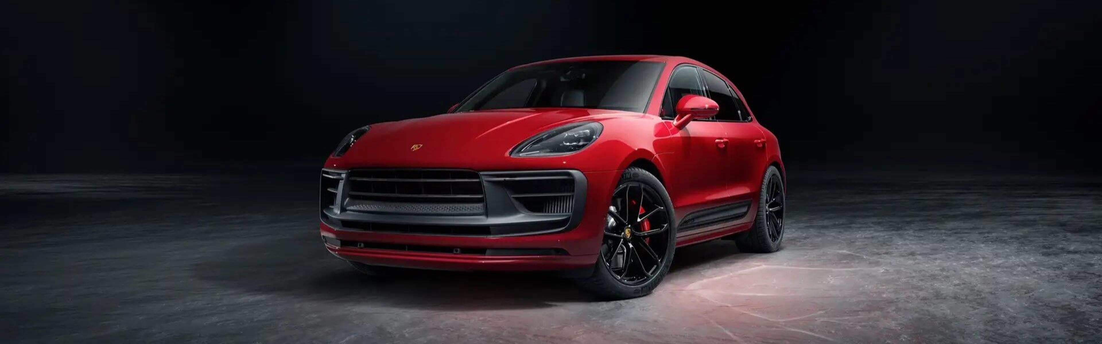 2024 Porsche Macan Parked In A Showroom Banner