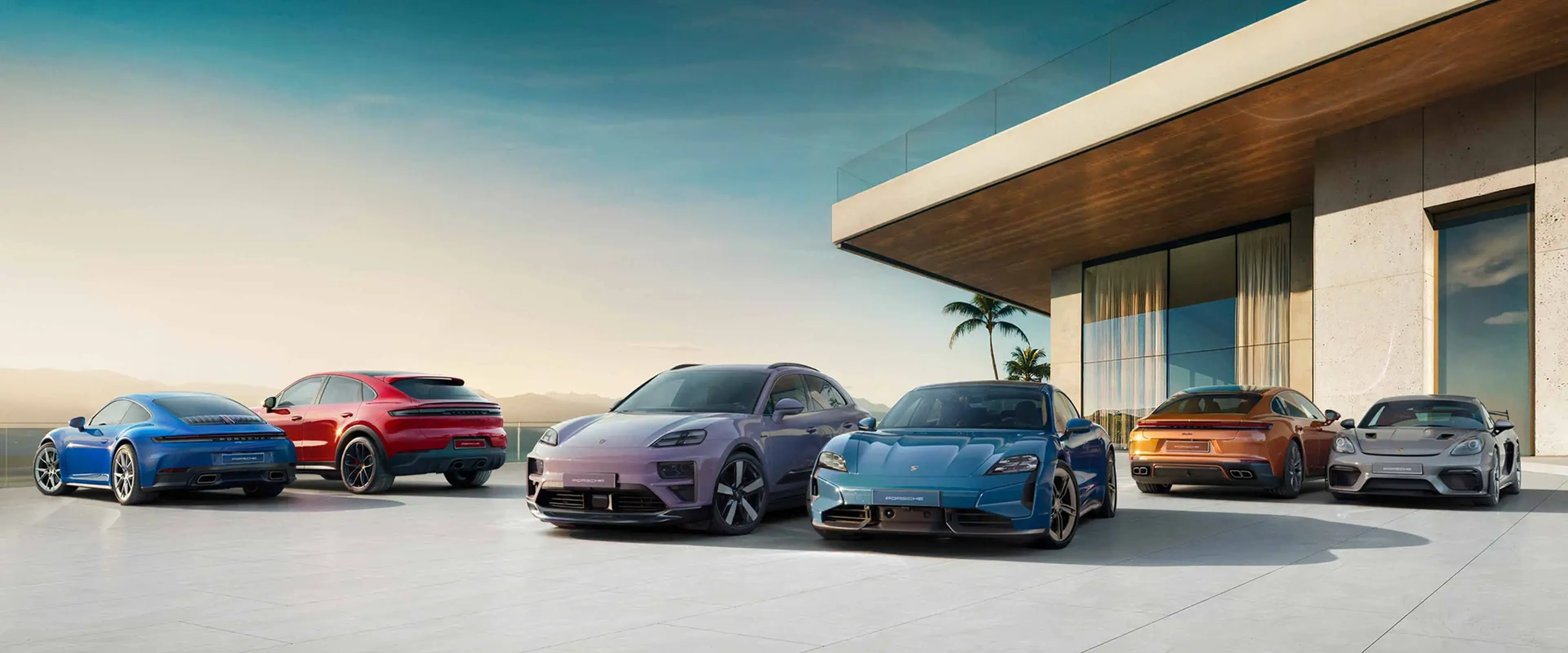 A lineup of Porsche vehicles parked outside a modern glass building
