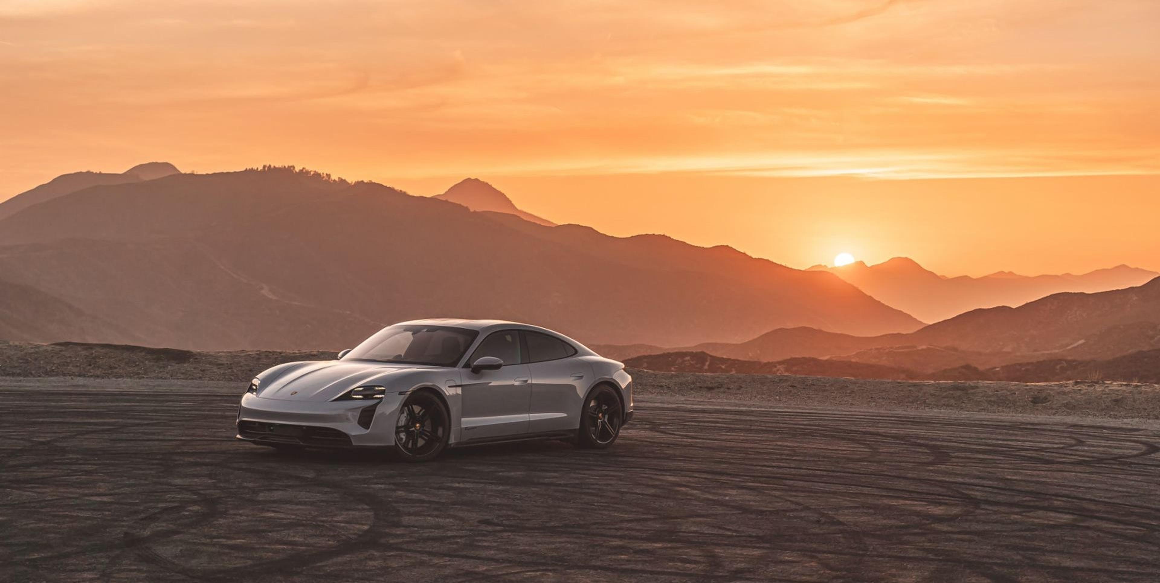 Porsche Taycan in the desert at sunset
