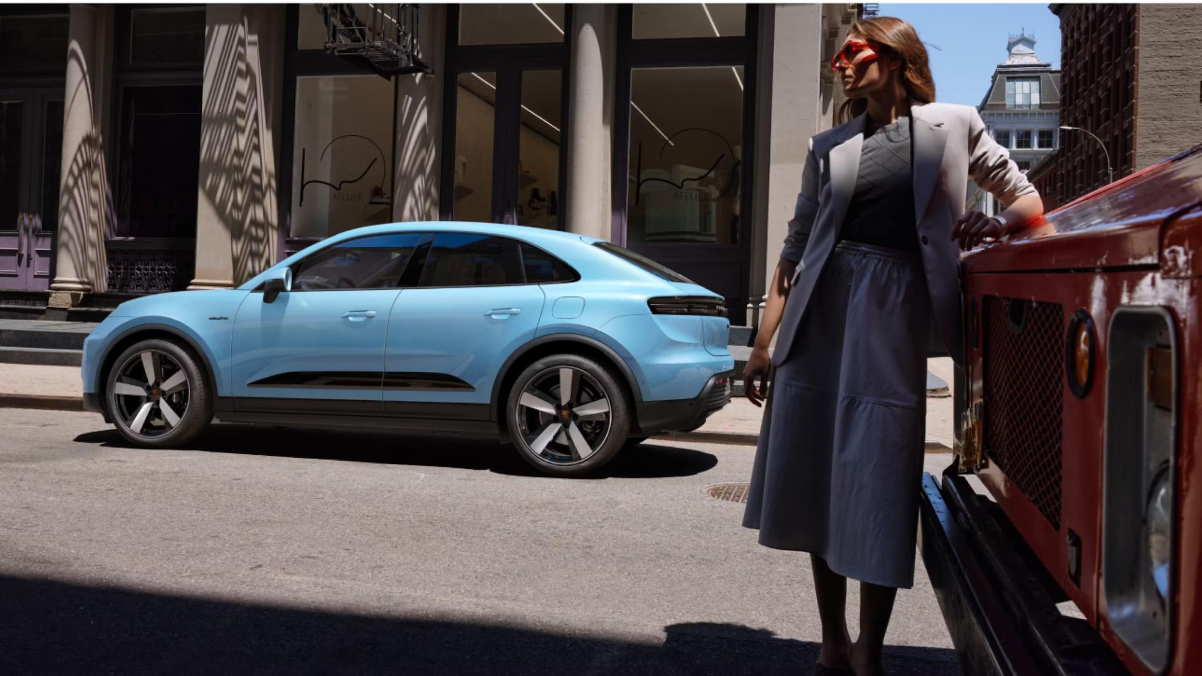 Porsche Macan EV front view showcasing sleek design and LED headlights.