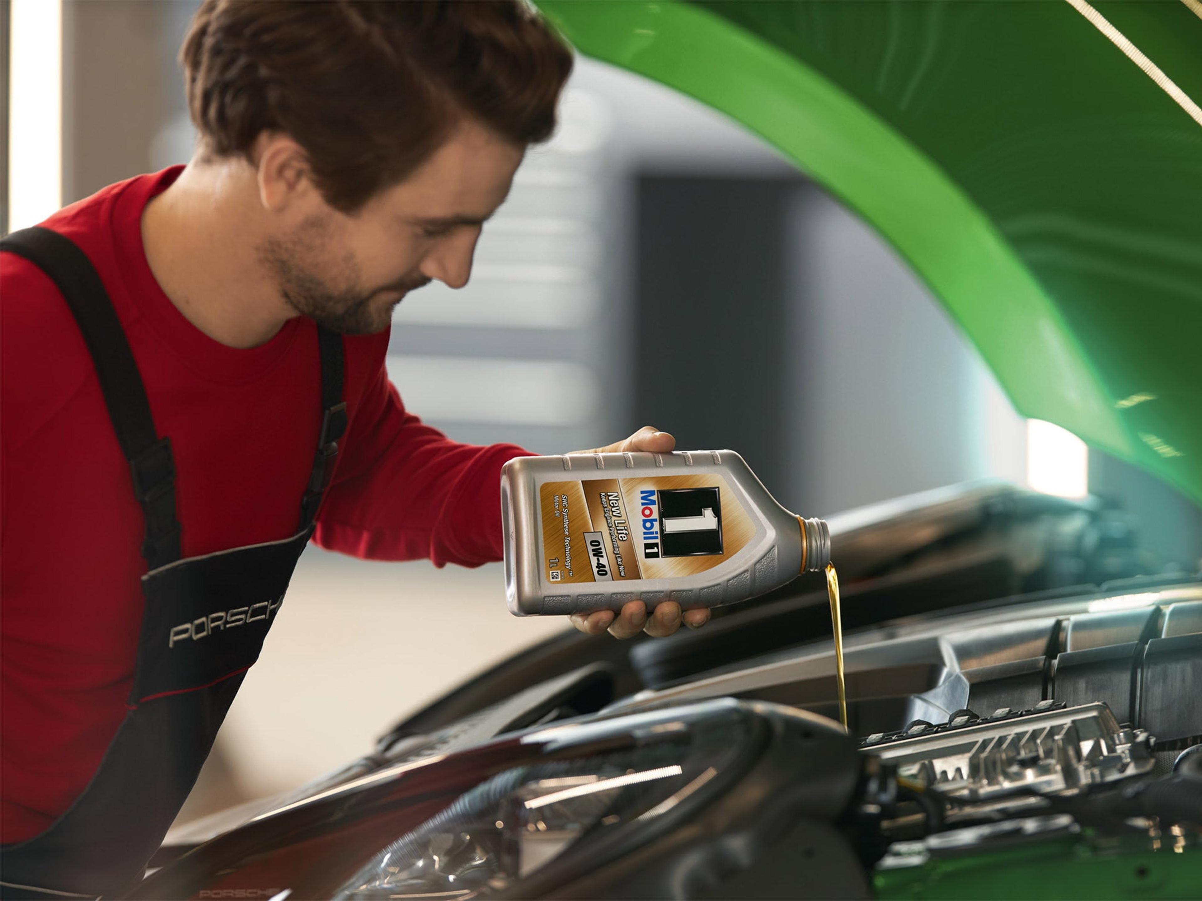 Porsche motor oil being added during an oil change