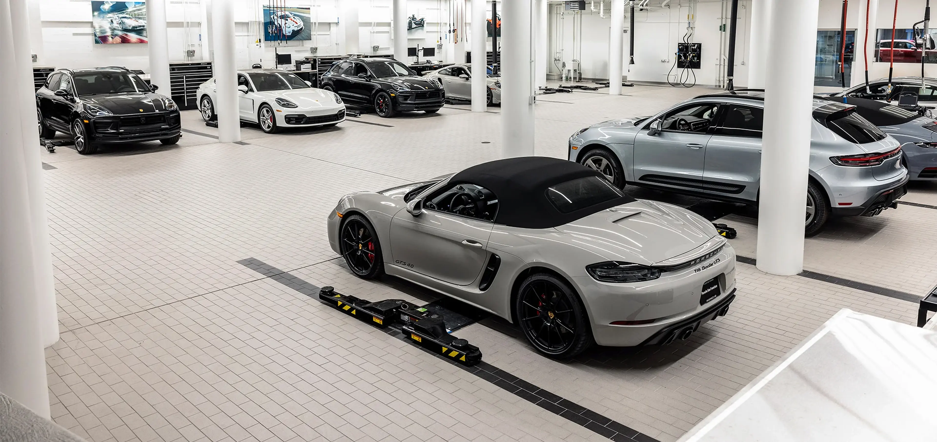 Silver Porsche 718 Boxster in the service center