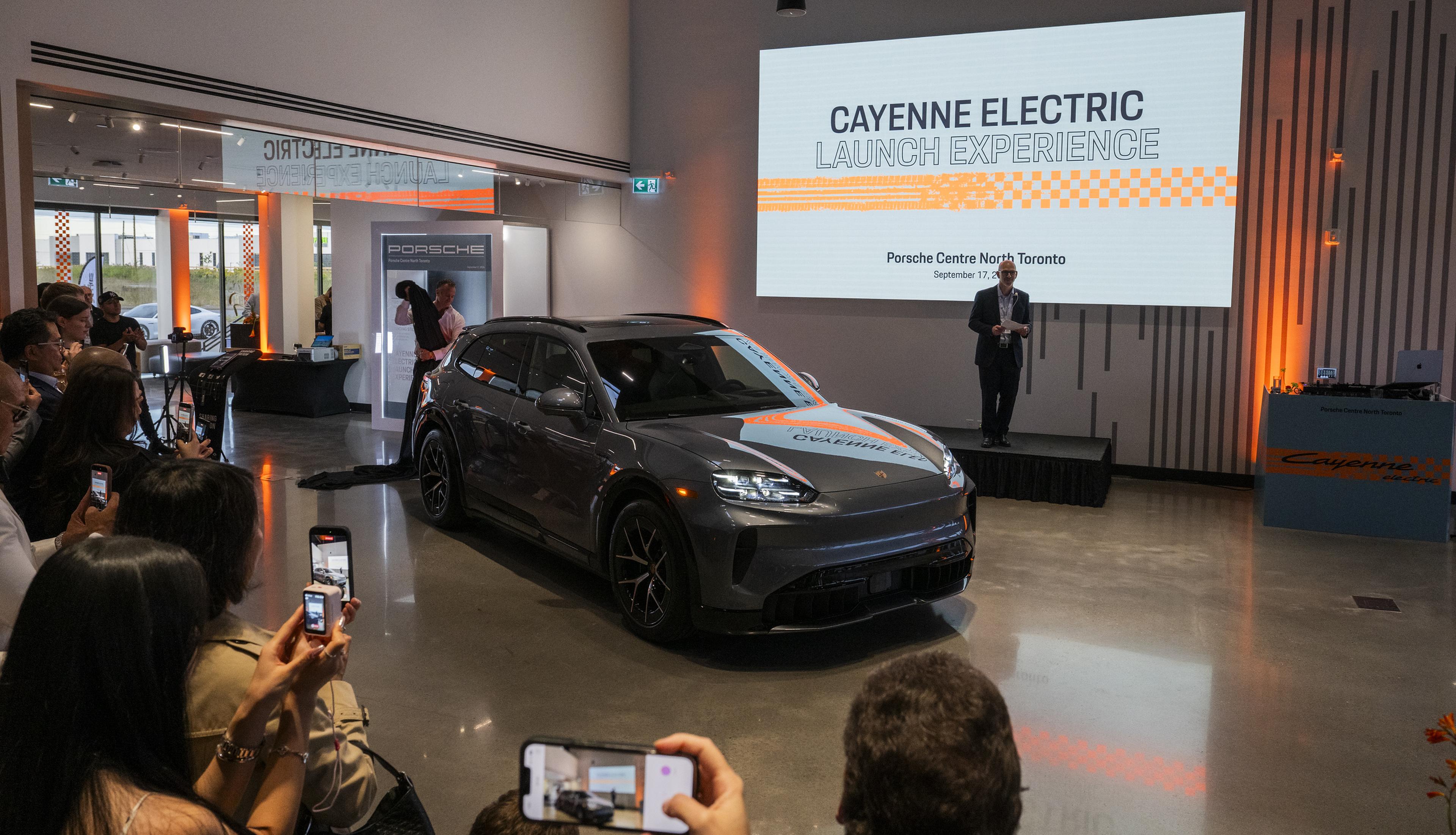 Graham MacNab, managing director Porsche Centre North Toronto delivers his speech to our guests while the Cayenne Electric is unveiled.