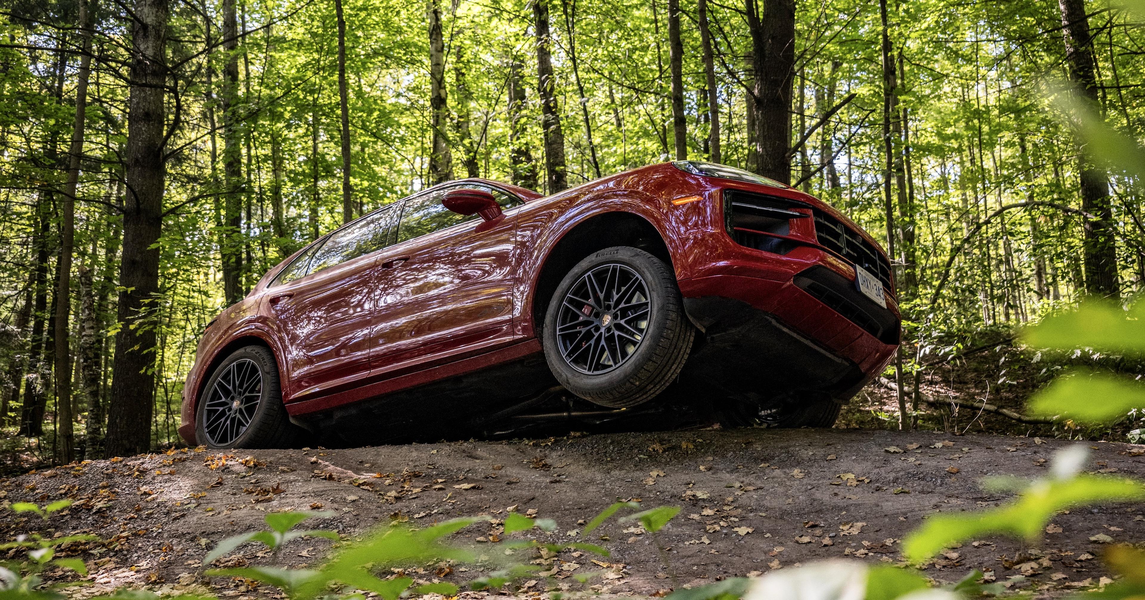 2026 Porsche Roadshow Canada Offroad Guards Red Cayenne GTS on 3 wheels.