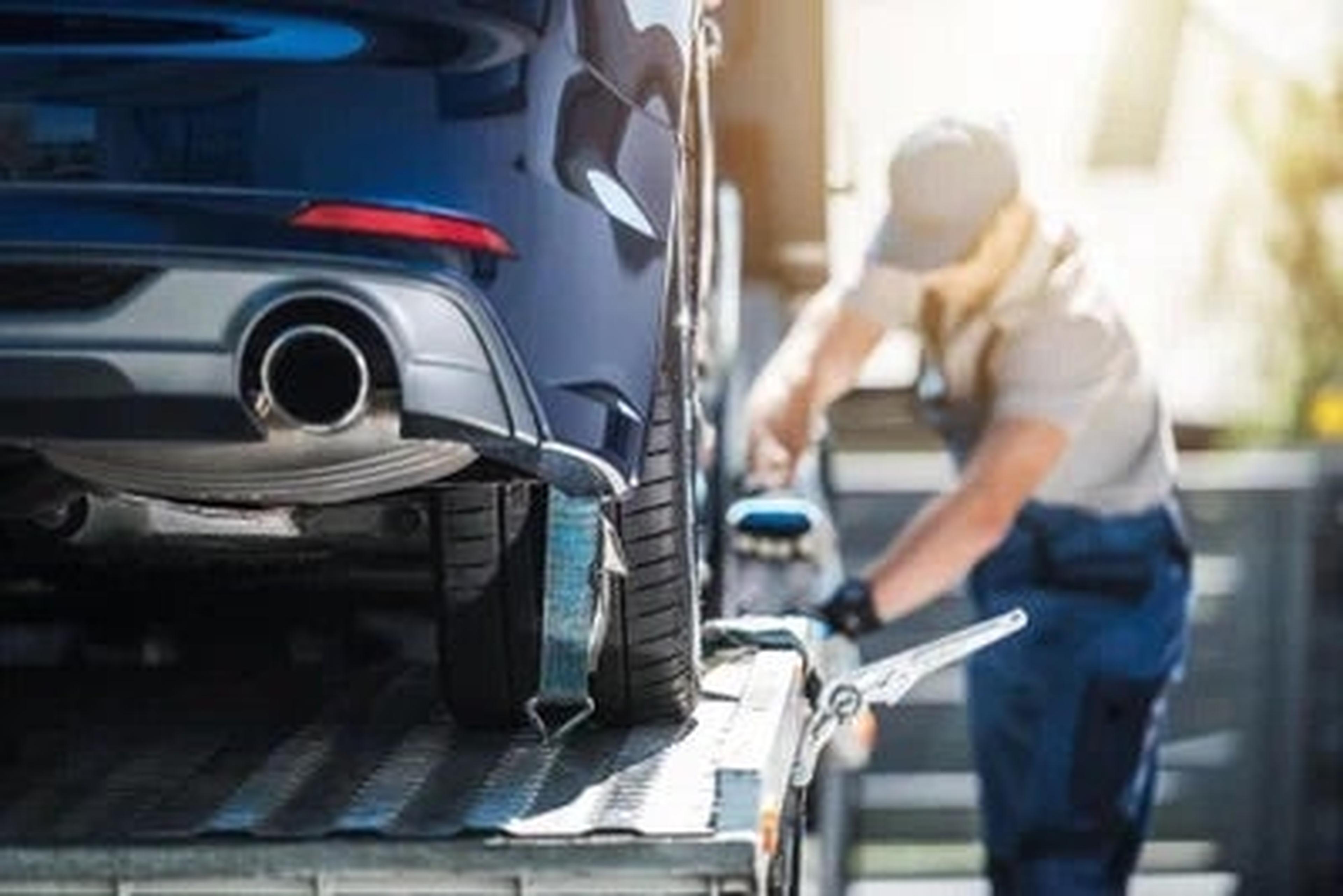 Porsche technician working on a vehicle