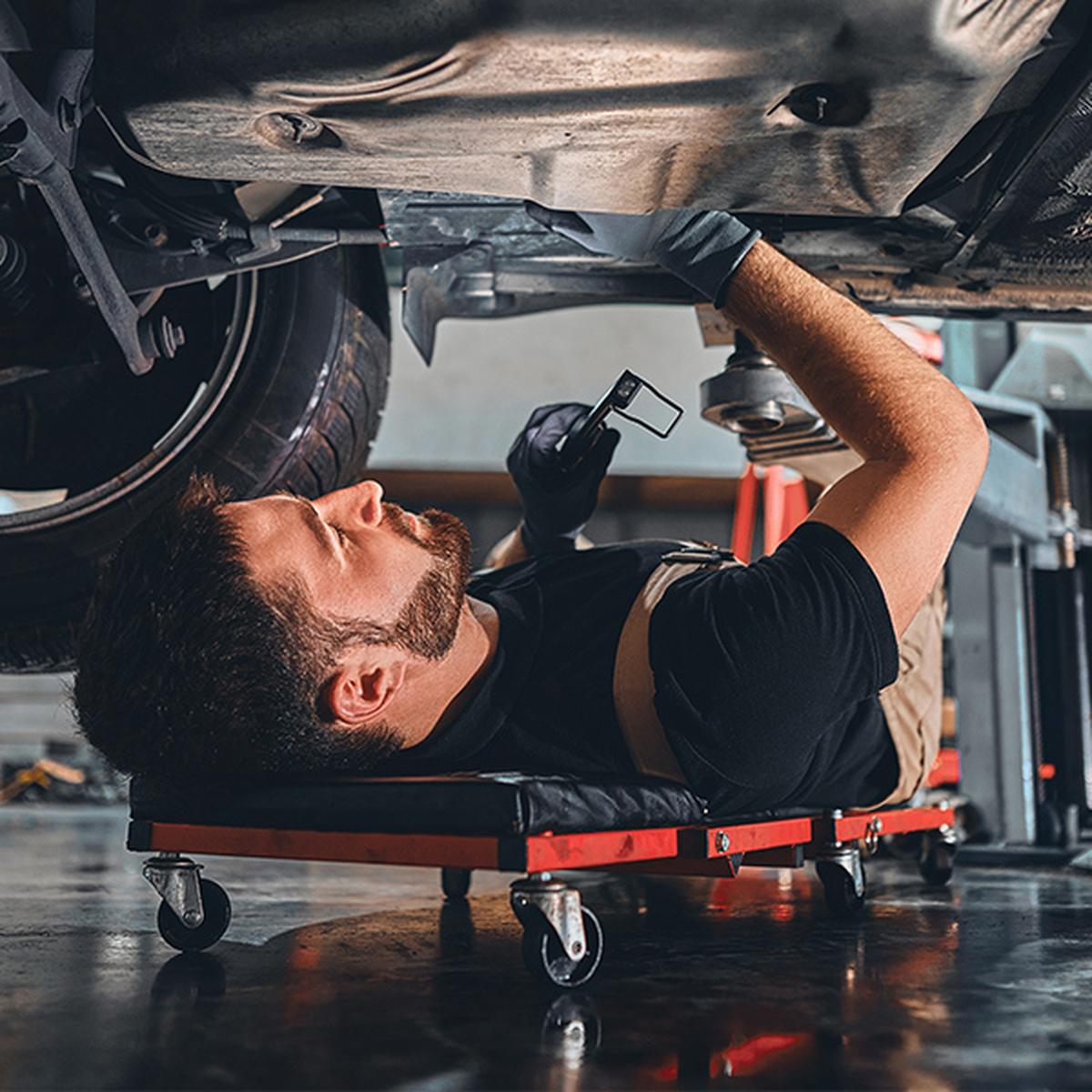 Mechanic working under vehicle
