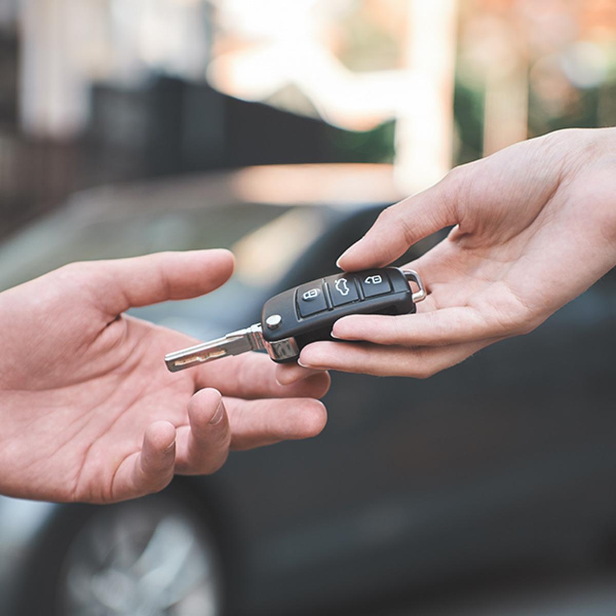 Car keys being handed over