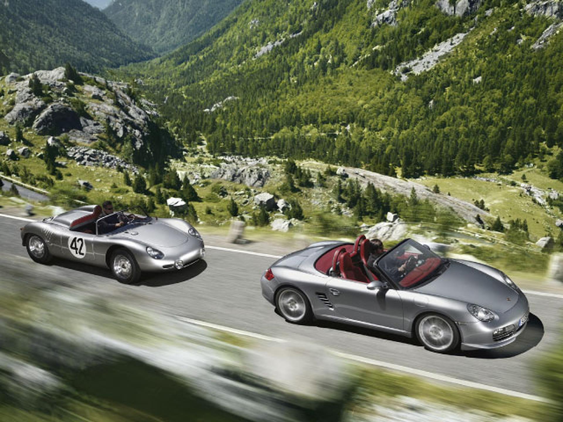 silver porsche convertible on mountain road
