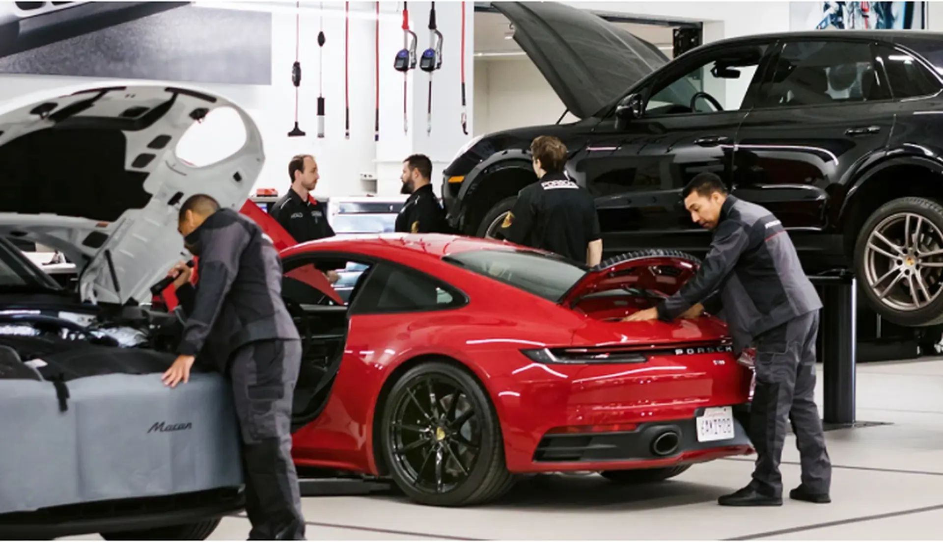 Red Porsche 911 in the parts and service area