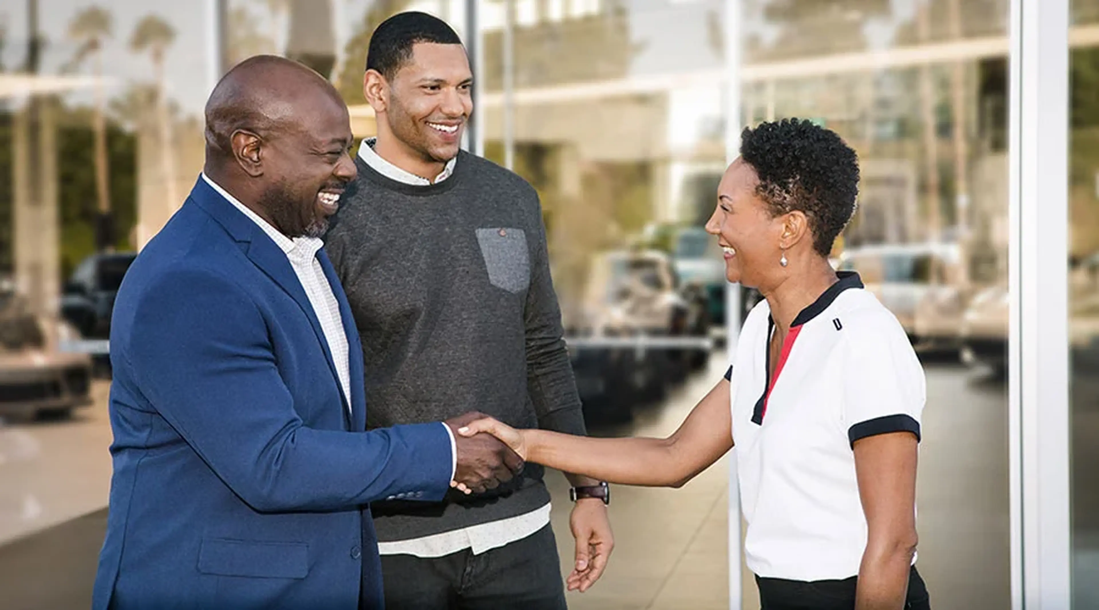 Porsche San Francisco advisor shaking hands with a customer