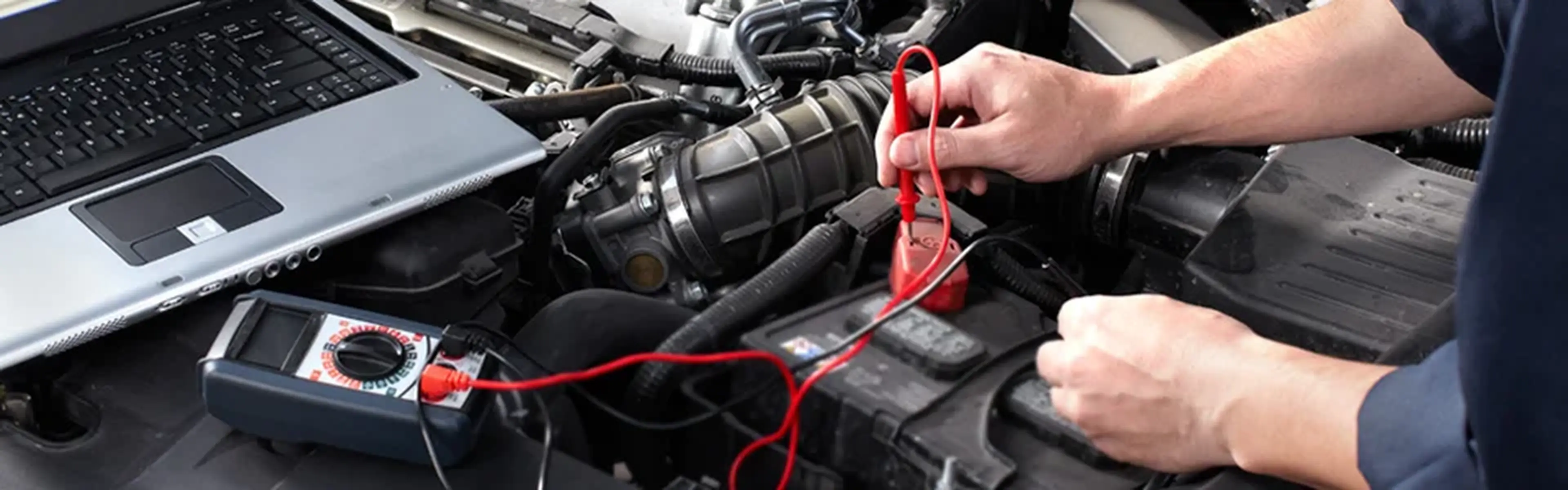 Technician testing a Porsche battery
